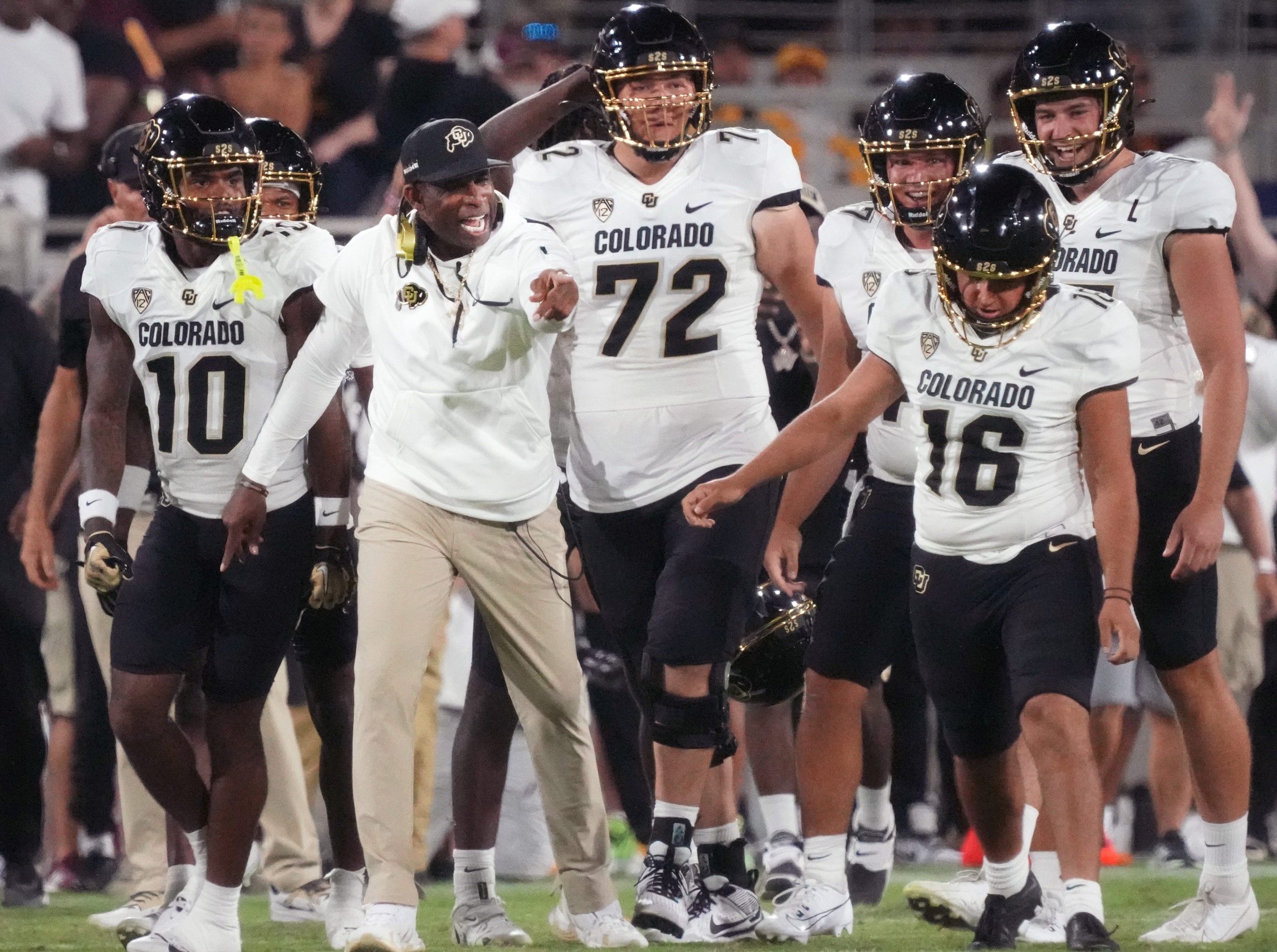 Oct 7, 2023; Tempe, Arizona, USA; Colorado Buffaloes head coach Deion Sanders celebrates with his kicker Alejandro Mata (16) after his last-minute field goal to win 27-24 over the ASU Sun Devils at Mountain America Stadium.