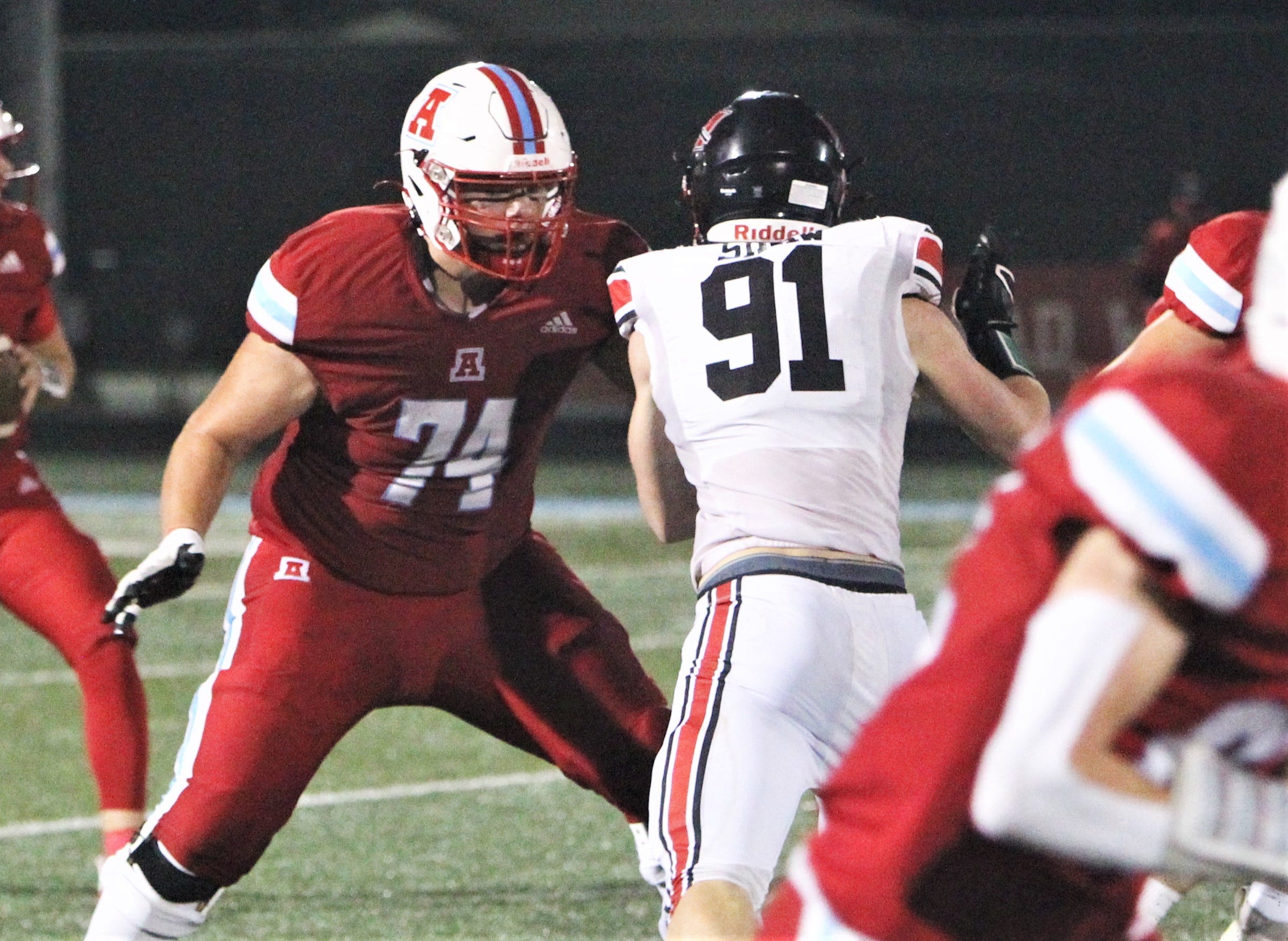 Arrowhead tackle Derek Jensen pass protects against Muskego's Liam Shaw on Friday Sept. 29, 2023 at Arrowhead High School in Town of Merton, Wisconsin.