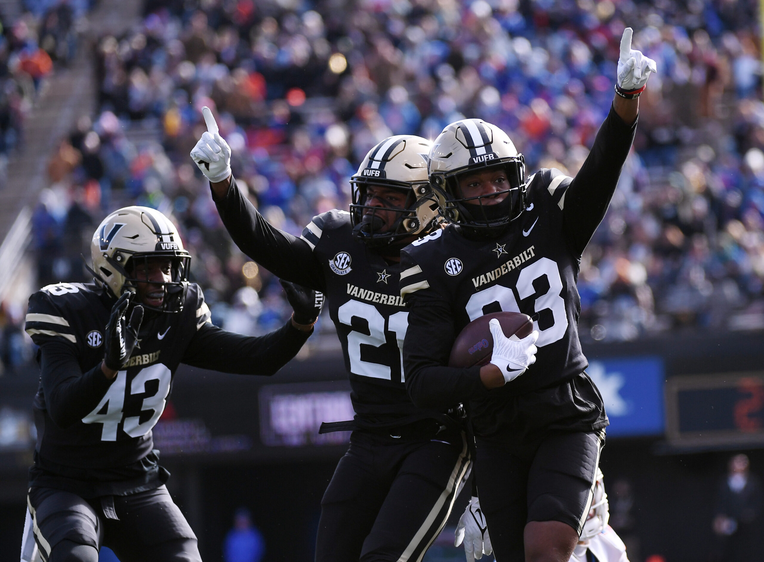Nov 19, 2022; Nashville, Tennessee, USA; Vanderbilt Commodores defensive back Jaylen Mahoney (23) linebacker De'Rickey Wright (43) and safety Maxwell Worship (21) celebrate after an interception during the second half against the Florida Gators at FirstBank Stadium.