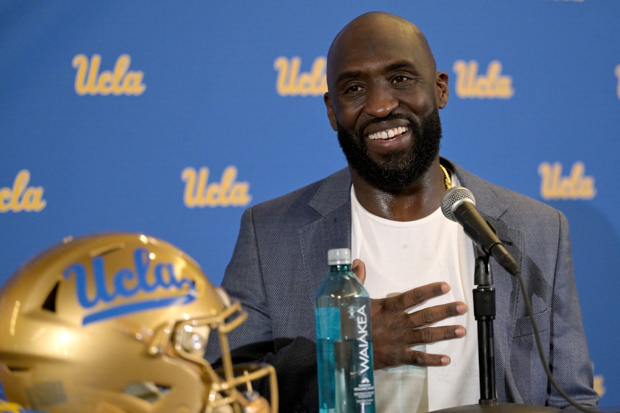 Feb 13, 2024; Los Angeles, CA, USA; DeShaun Foster answers questions from media after he was introduced as the new head football coach of UCLA Bruins during a press conference at Pauley Pavilion.
