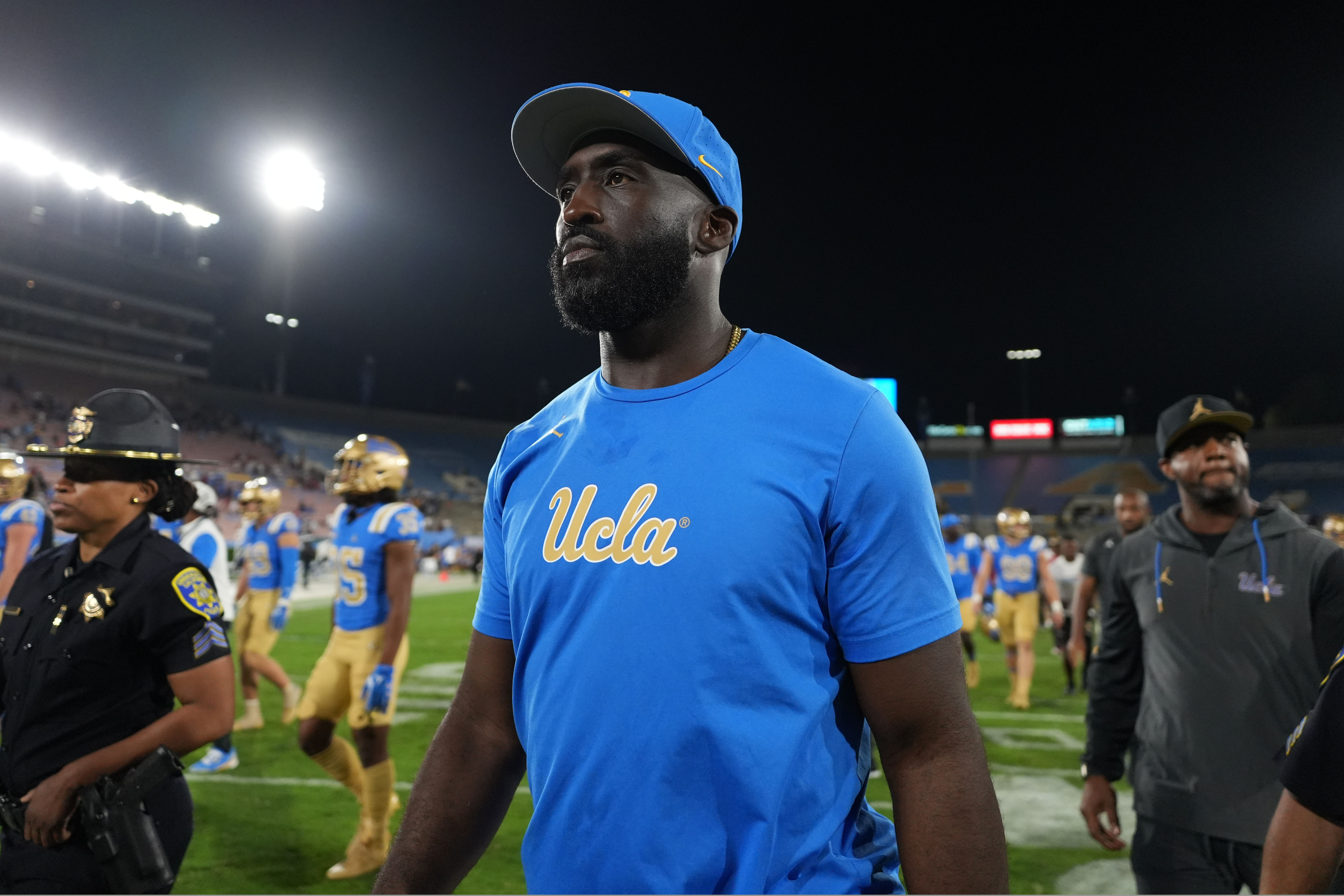 Feb 13, 2024; Los Angeles, CA, USA; DeShaun Foster answers questions from media after he was introduced as the UCLA Bruins head football coach during a press conference at Pauley Pavilion.