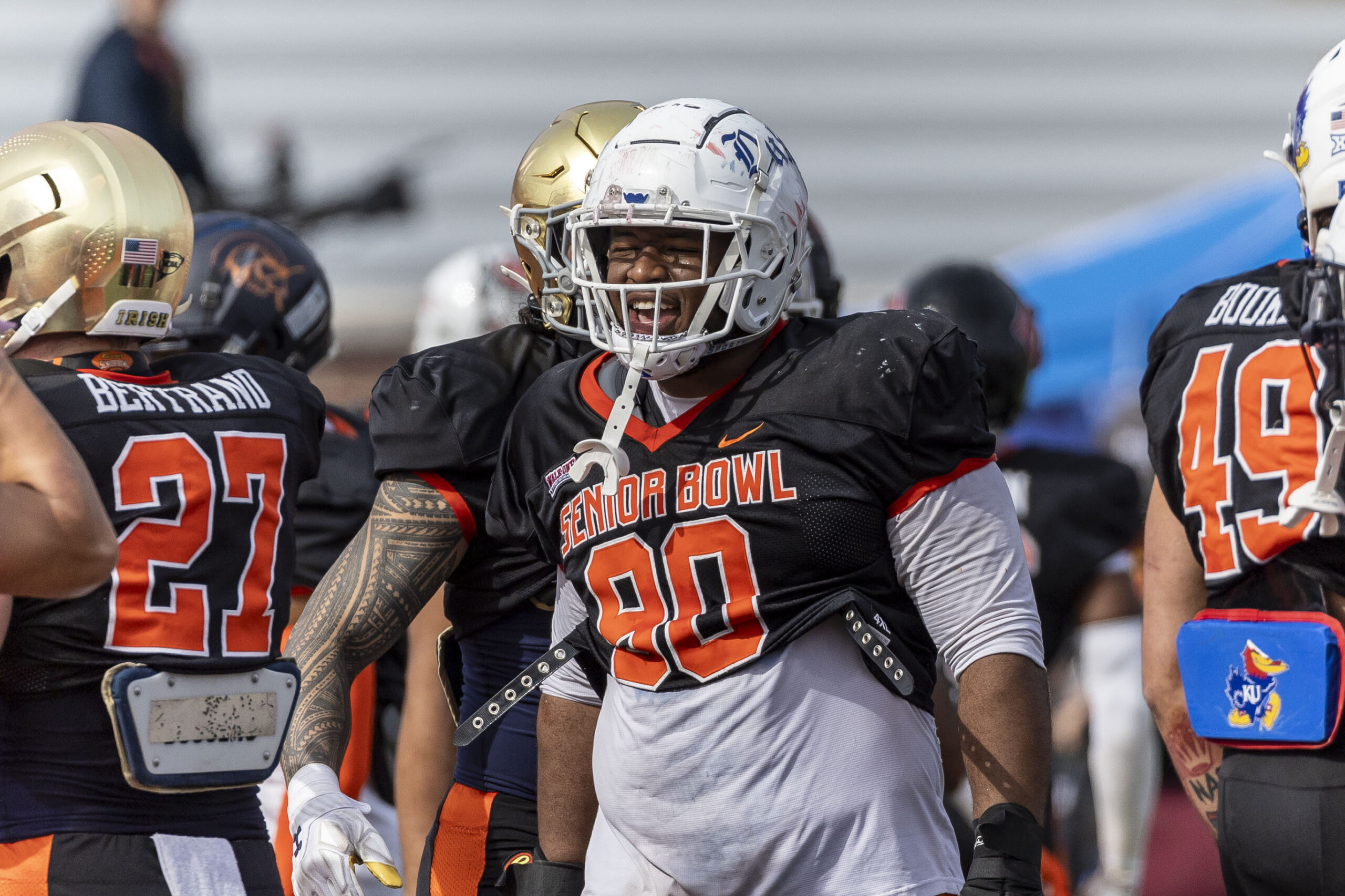 Feb 1, 2024; Mobile, AL, USA; National defensive lineman DeWayne Carter of Duke (90) grins after breaking from a team gathering during practice for the National team at Hancock Whitney Stadium.