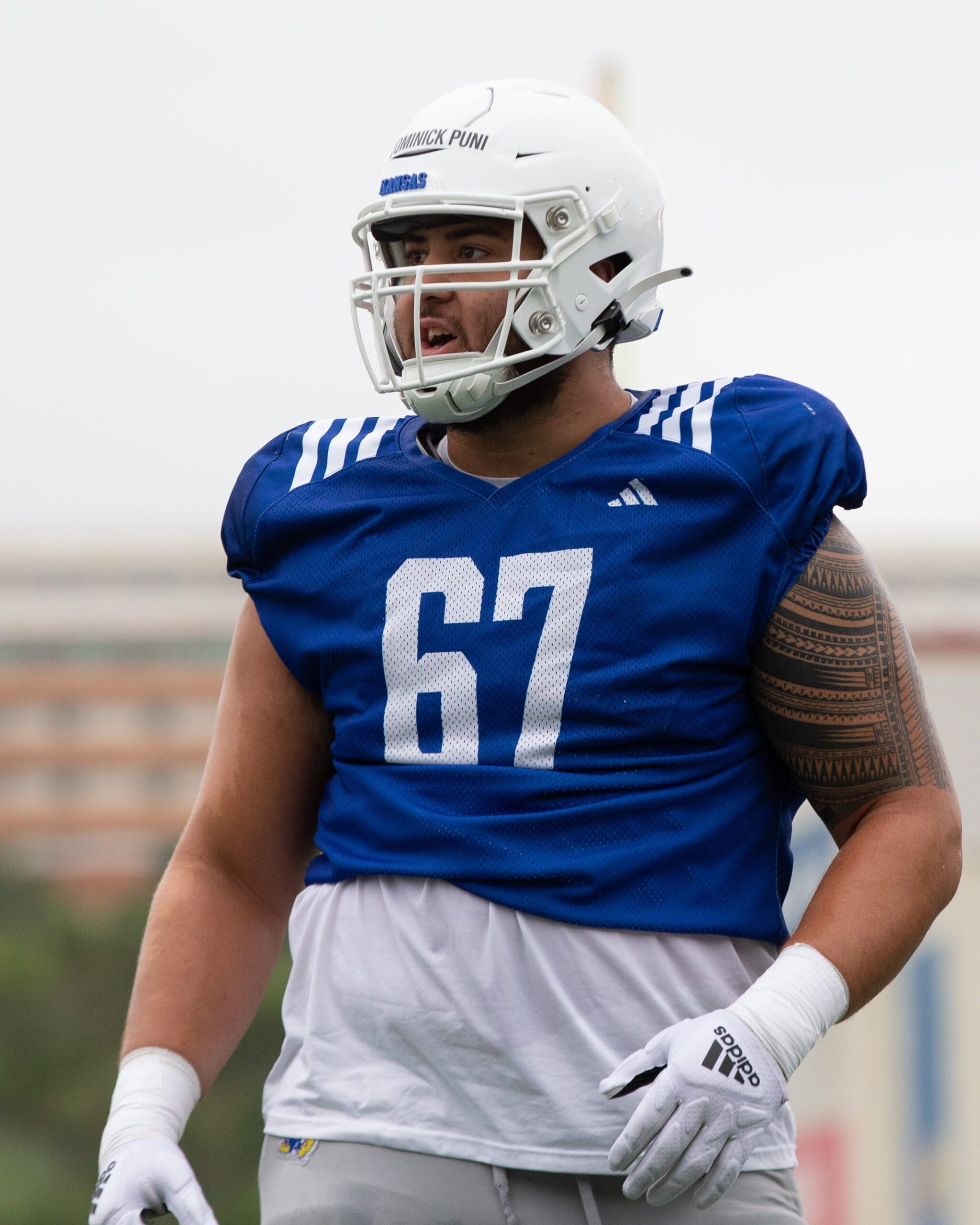 Kansas redshirt senior offensive lineman Dominick Puni (67) is seen during Monday's outdoor practice.