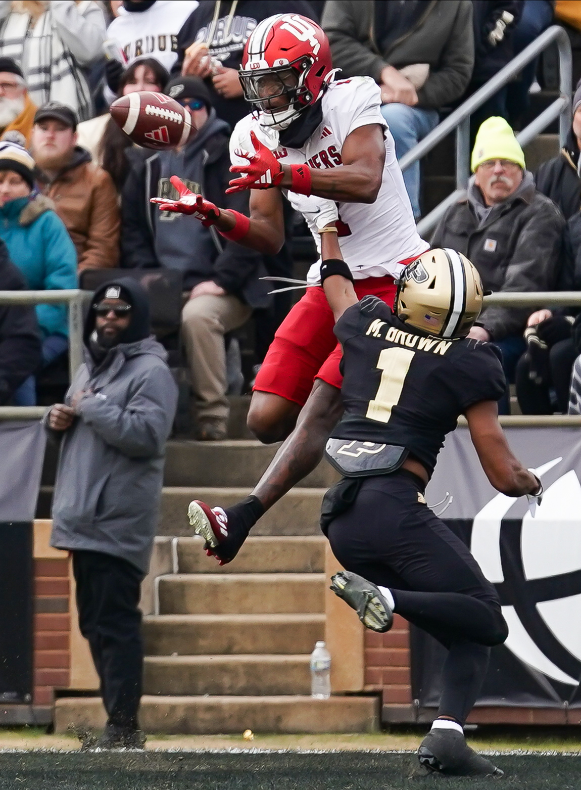 Nov 25, 2023; West Lafayette, Indiana, USA; Indiana Hoosiers wide receiver Donaven McCulley (1) catches a pass for a touchdown over Purdue Boilermakers defensive back Markevious Brown (1) during the first half at Ross-Ade Stadium.