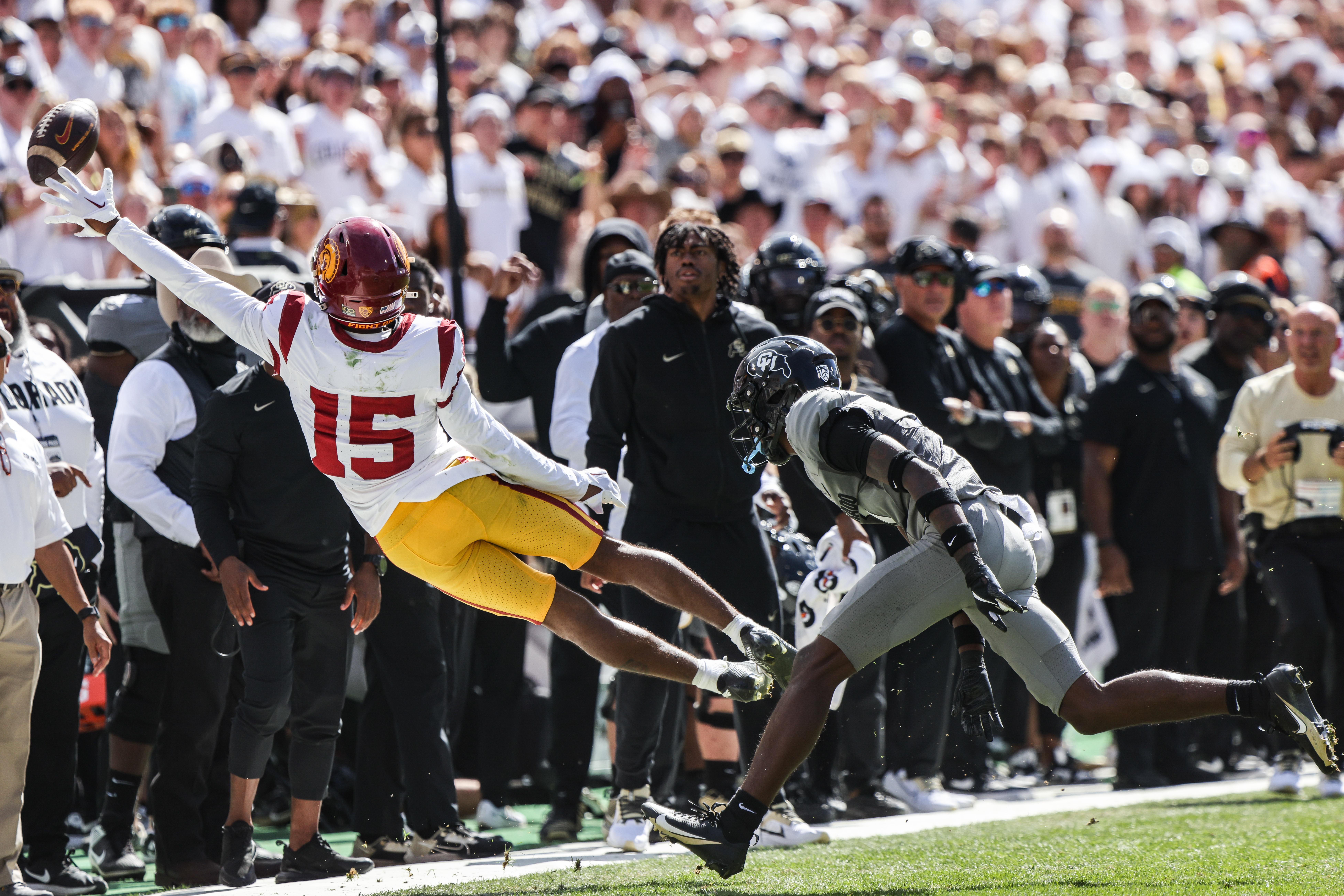 Sep 30, 2023; Boulder, Colorado, USA; USC Trojans wide receiver Dorian Singer (15) attempts to pull in a pass during the game against the Colorado Buffaloes at Folsom Field.
