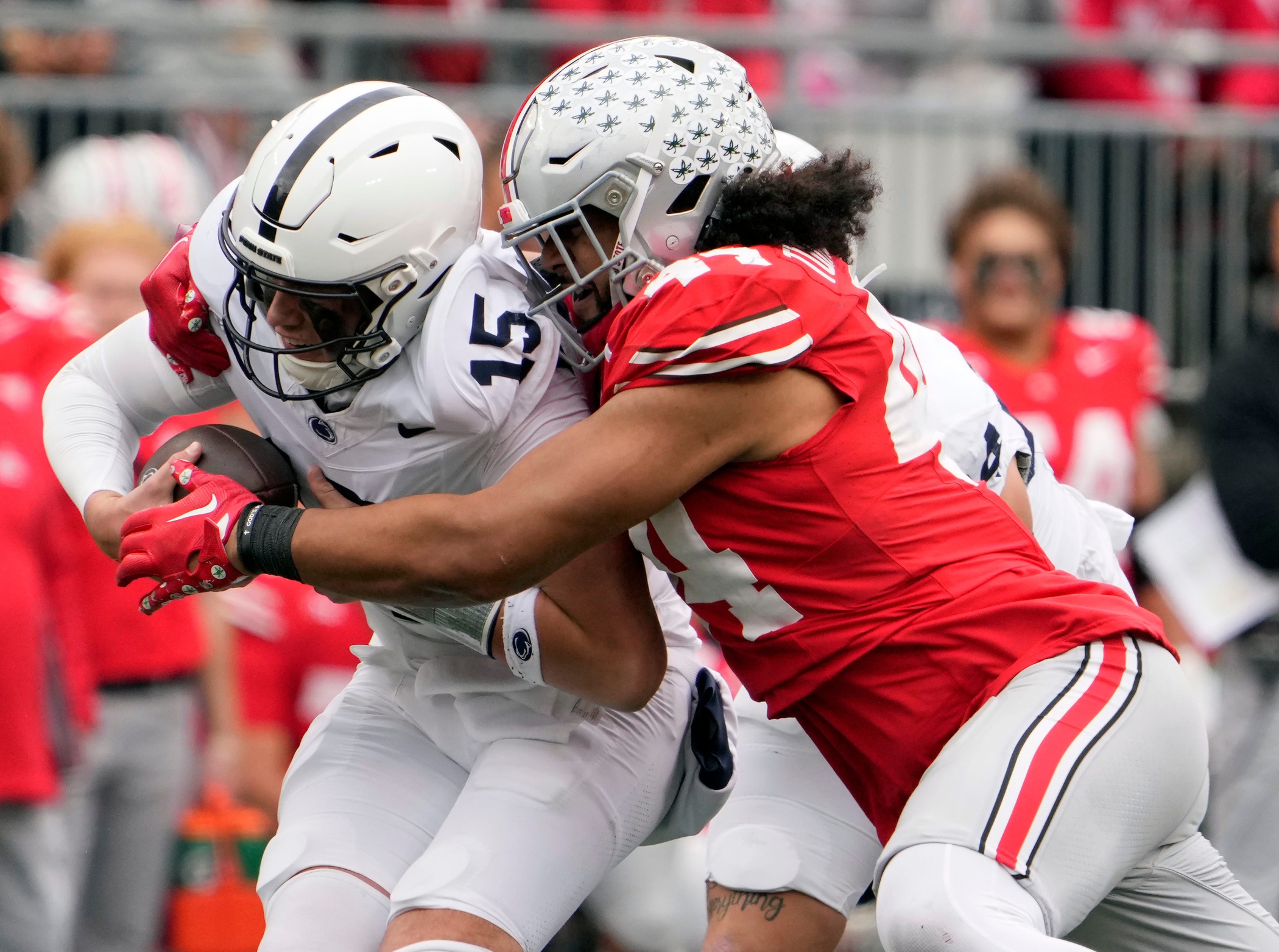 Oct 21, 2023; Columbus, Ohio, USA; Ohio State Buckeyes defensive end JT Tuimoloau (44) sacks Penn State Nittany Lions quarterback Drew Allar (15) during the fourth quarter of their game at Ohio Stadium.