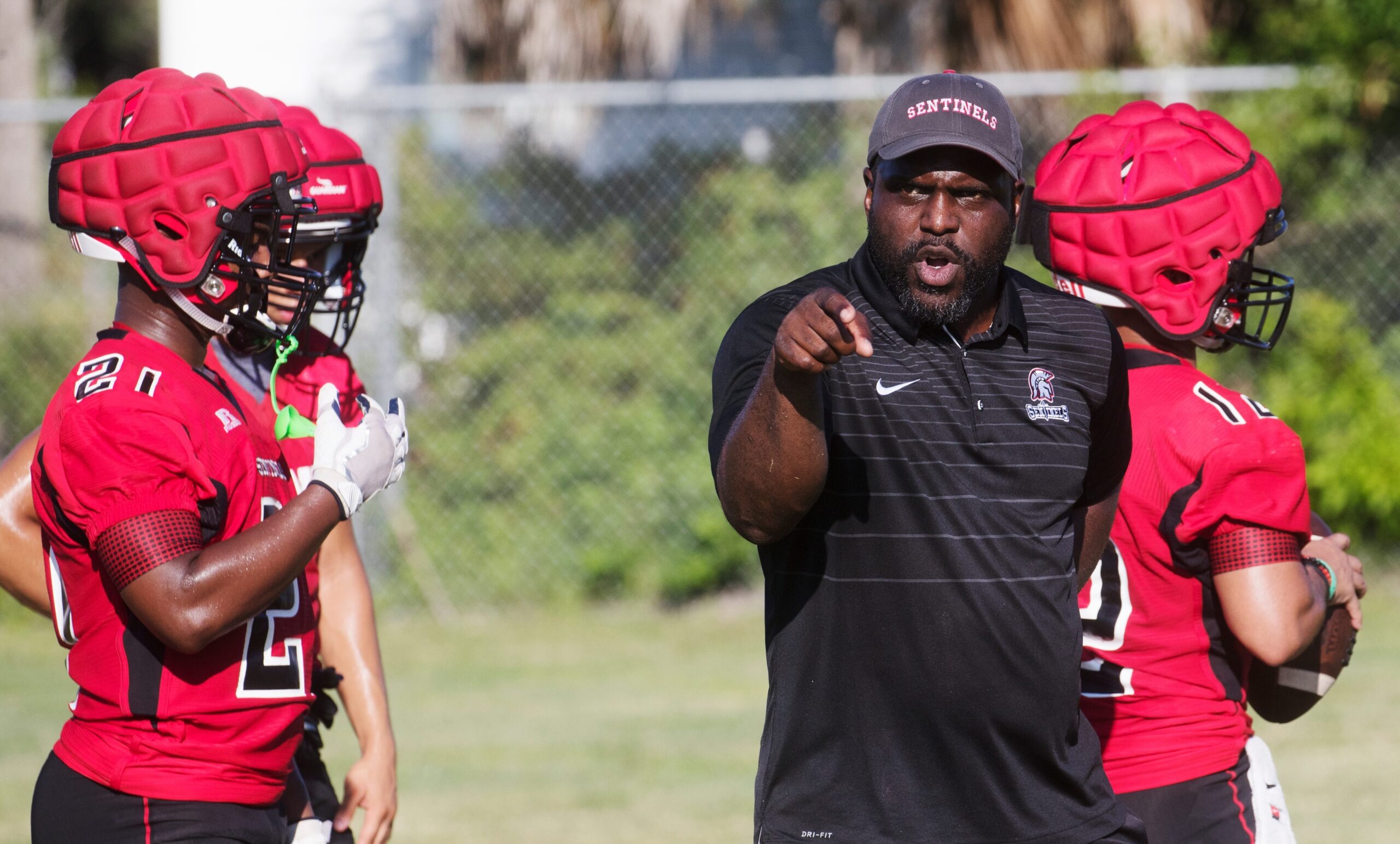 Evangelical Christian School coach Earnest Graham calls a play during practice on the first day of football practice for High Schools on Monday July, 29, 2019.
