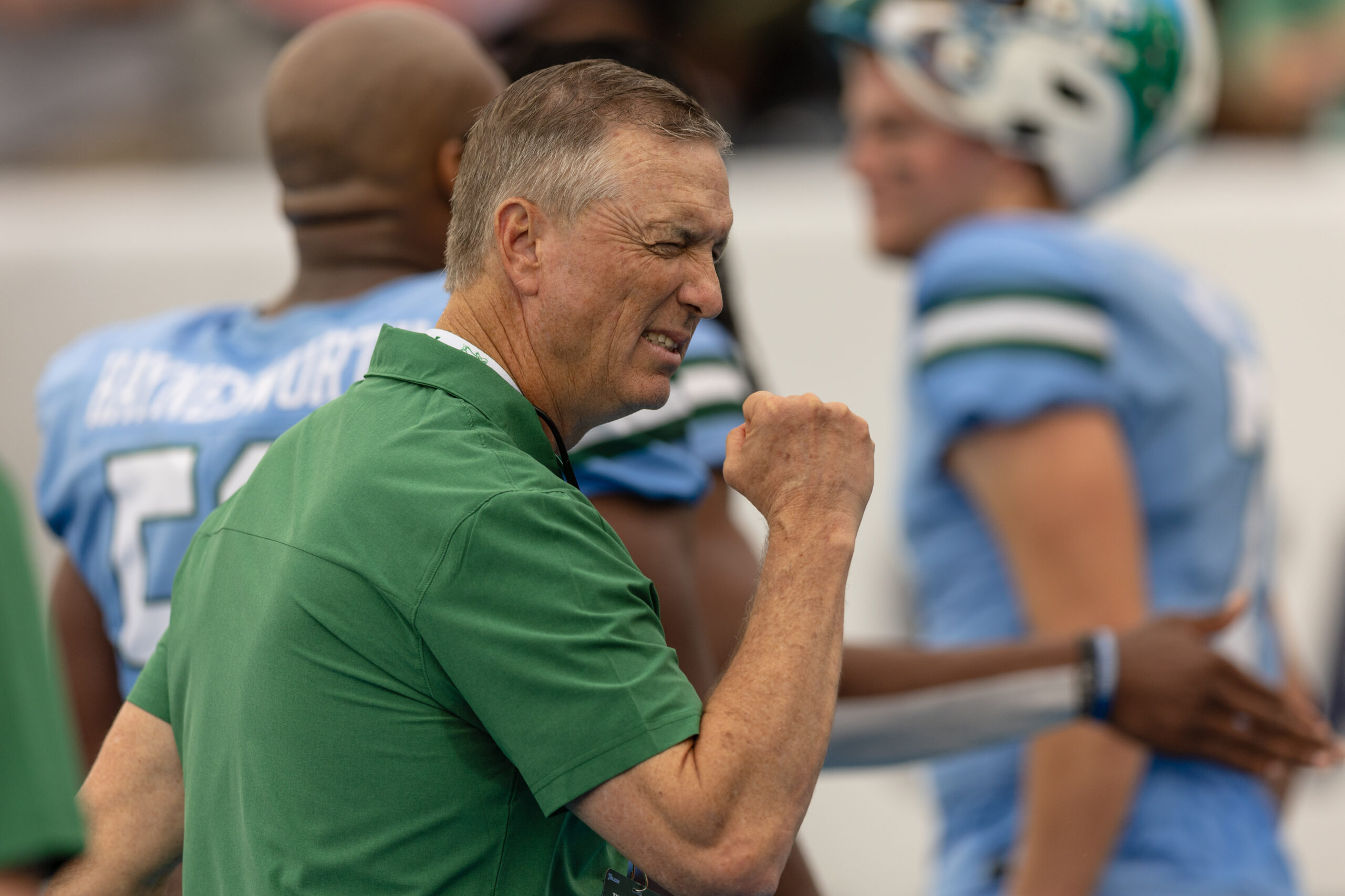 Dec 3, 2022; New Orleans, Louisiana, USA; Tulane Green Wave head coach Willy Fritz reacts to a fan with a fist bump against the UCF Knights during the first half at Yulman Stadium.