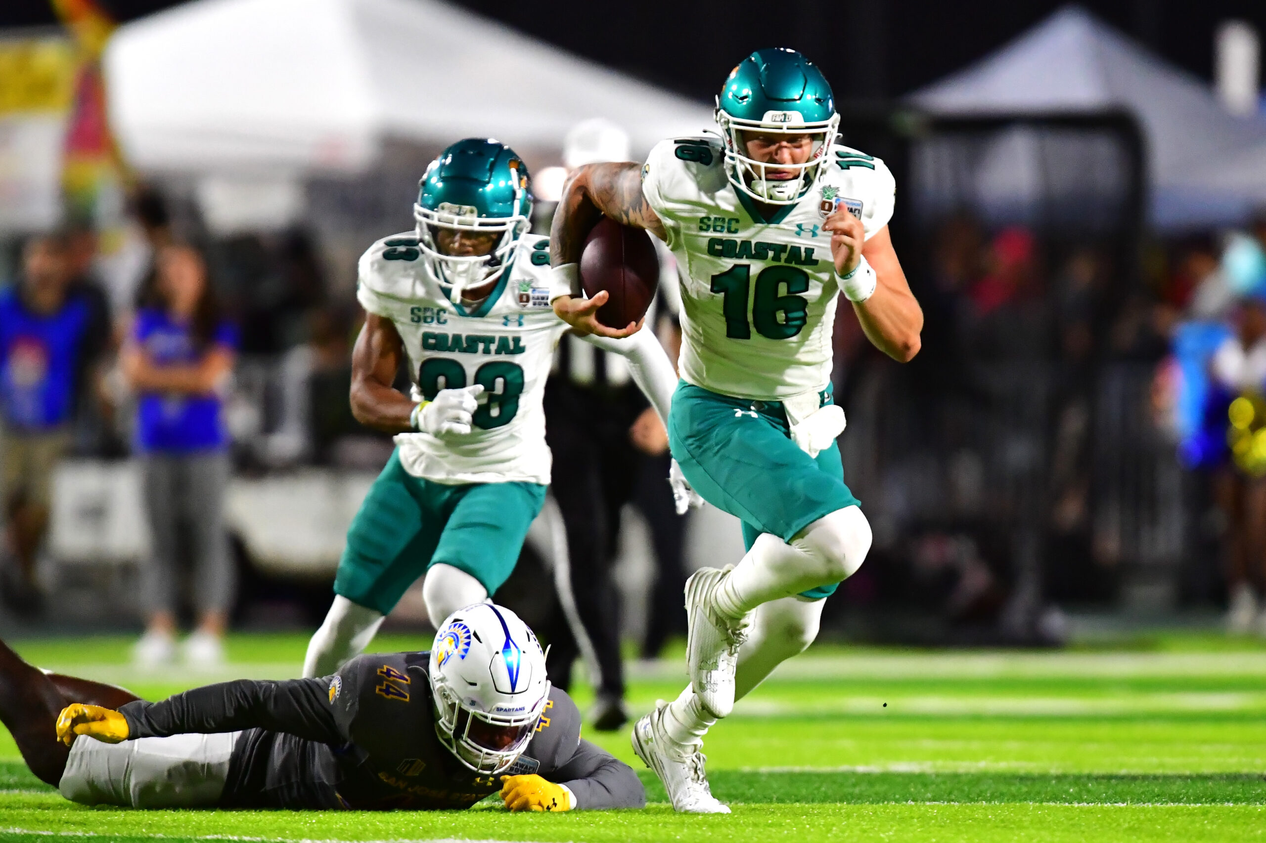 Dec 23, 2023; Honolulu, HI, USA; Coastal Carolina Chanticleers quarterback Ethan Vasko (16) runs the ball against the San Jose State Spartans during the second quarter of the Easypost Hawaii Bowl at Clarence T.C. Ching Athletics Complex.