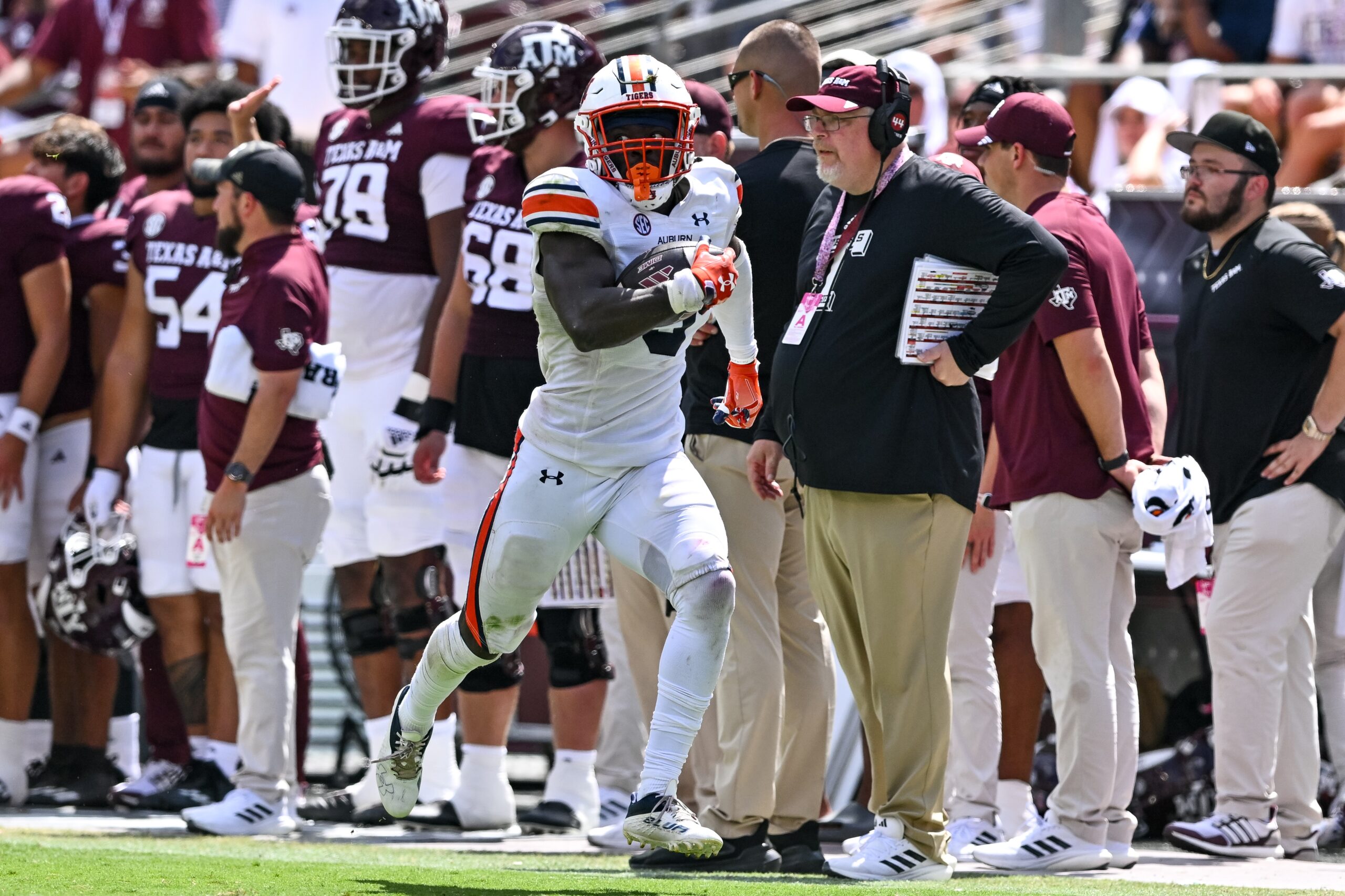 Sep 23, 2023; College Station, Texas, USA; Auburn Tigers linebacker Eugene Asante (9) returns a fumble for a touch down during the third quarter against the Texas A&M Aggies at Kyle Field.
