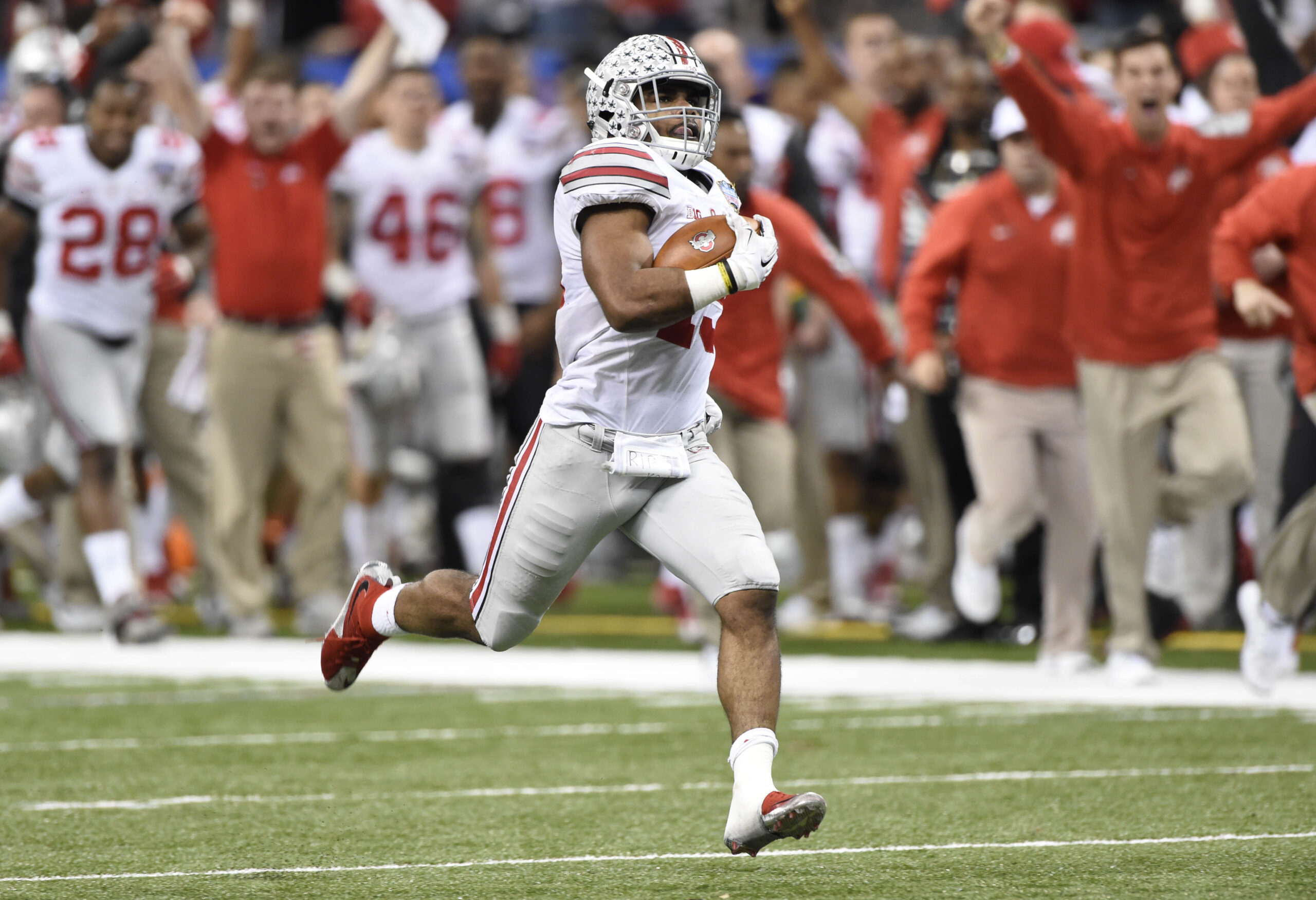 Jan 1, 2015; New Orleans, LA, USA; Ohio State Buckeyes running back Ezekiel Elliott (15) runs a touchdown during the fourth quarter in the 2015 Sugar Bowl against the Alabama Crimson Tide at Mercedes-Benz Superdome.