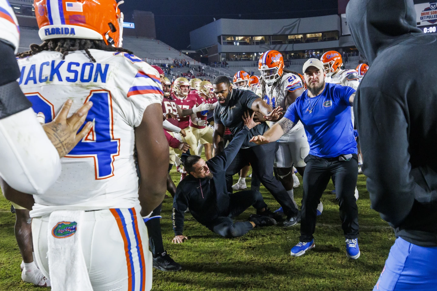 Florida State and Florida players scuffle at midfield after the Gators' 31-11 victory in Tallahassee, Fla.