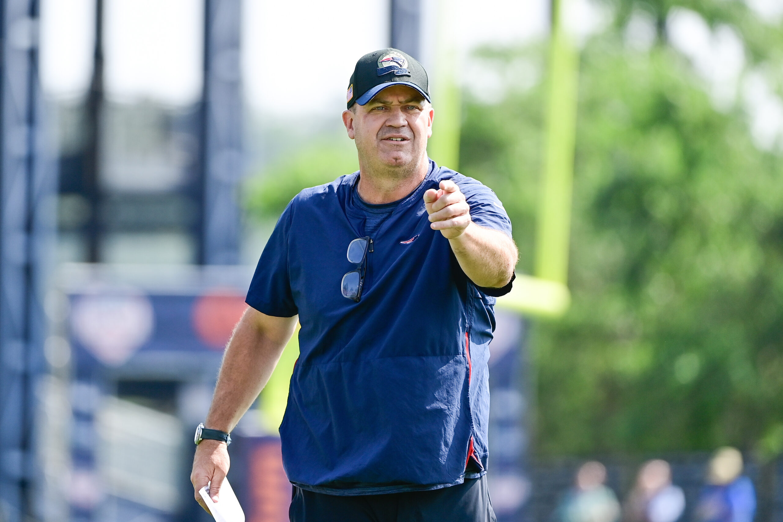 Jul 26, 2023; Foxborough, MA, USA; New England Patriots offensive coordinator/quarterbacks coach Bill O'Brien directs the office on a drill during training camp at Gillette Stadium.