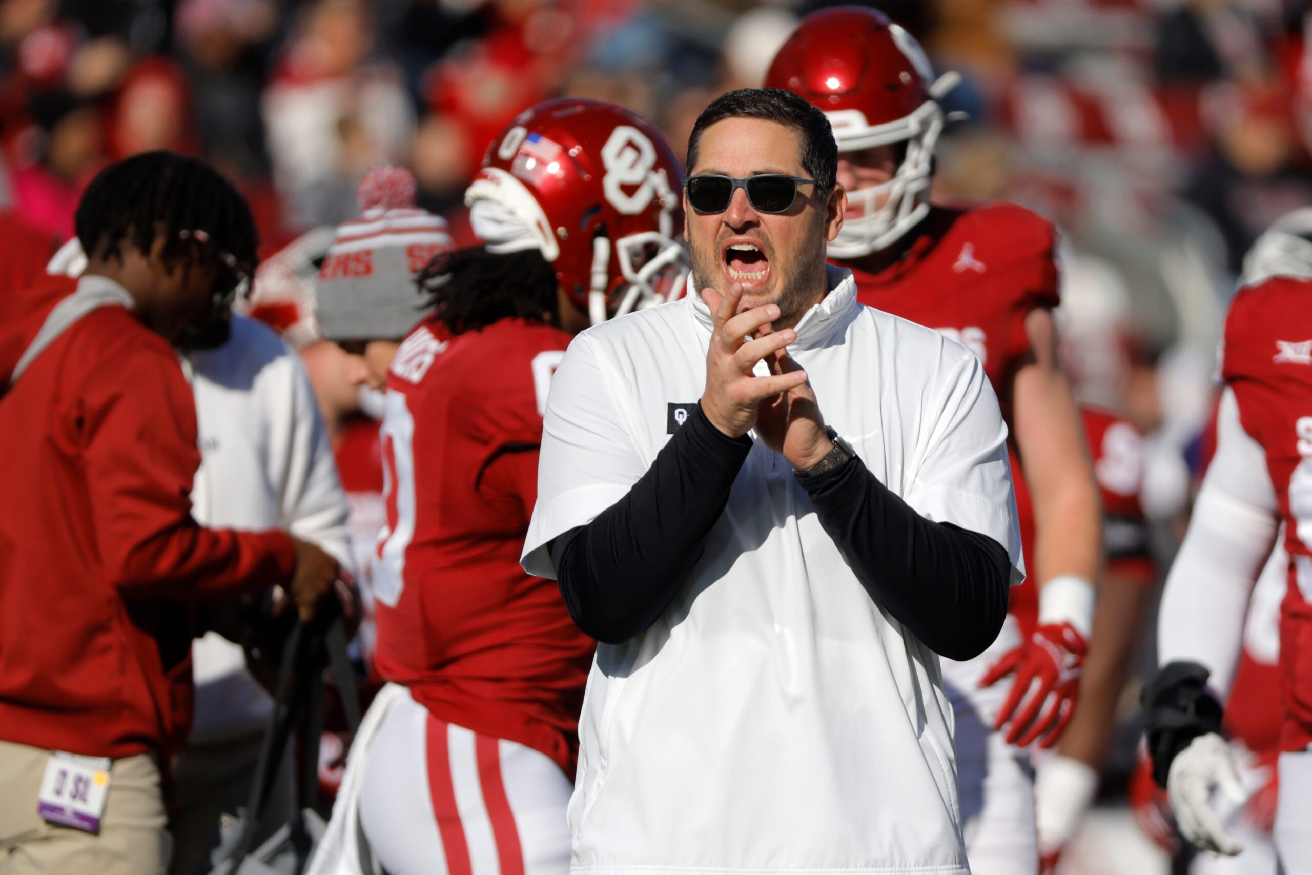 Oklahoma offensive coordinator Jeff Lebby claps and shouts as the Oklahoma Sooners warm up before a college football game between the University of Oklahoma Sooners (OU) and the TCU Horned Frogs at Gaylord Family-Oklahoma Memorial Stadium in Norman, Okla., Friday, Nov. 24, 2023. Oklahoma won 69-45.  