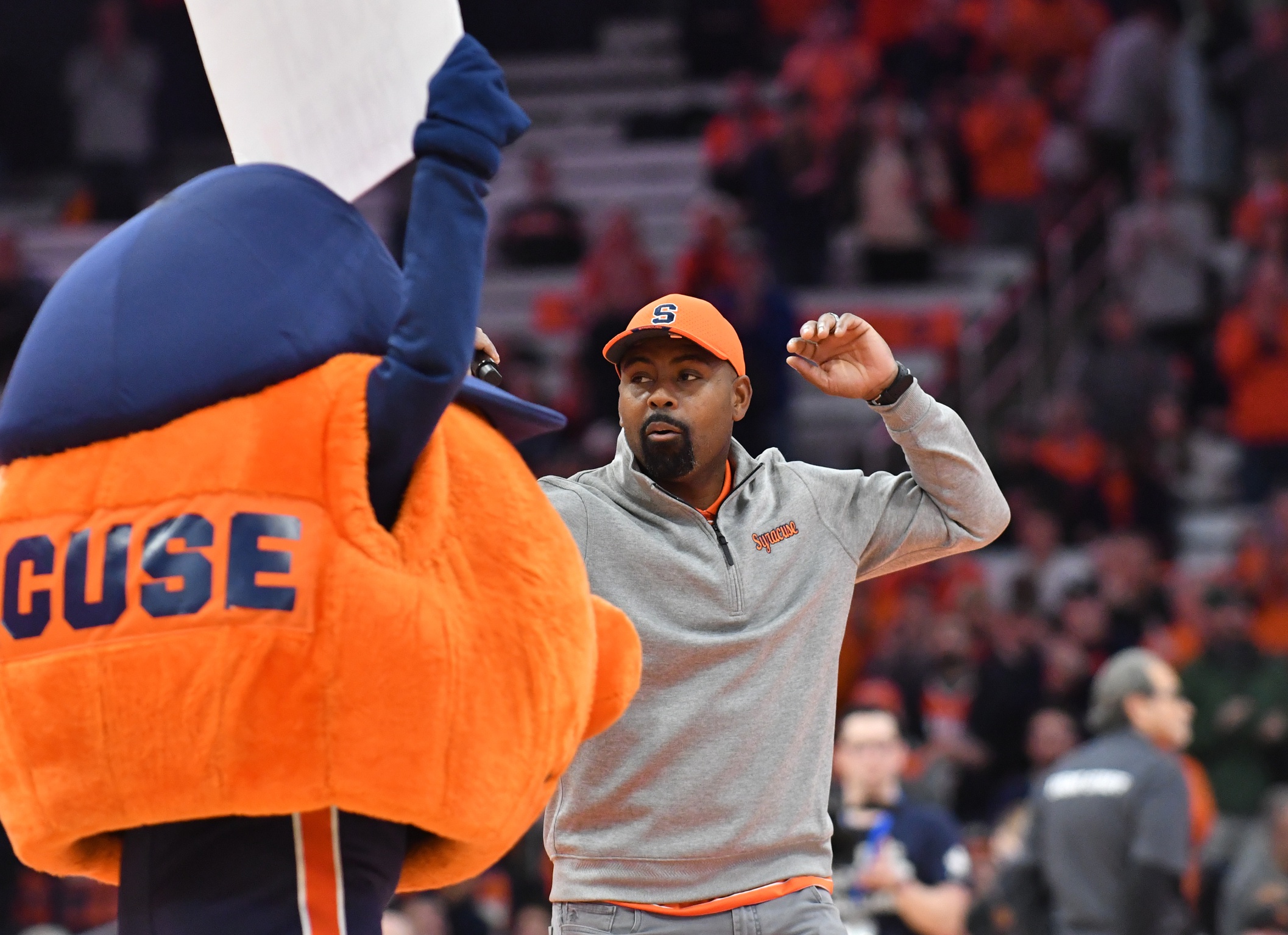 Dec 5, 2023; Syracuse, New York, USA; New Syracuse Orange head football coach Fran Brown addresses the crowd during a timeout in the first half of a basketball game between the Syracuse Orange and the Cornell Big Red at the JMA Wireless Dome.
