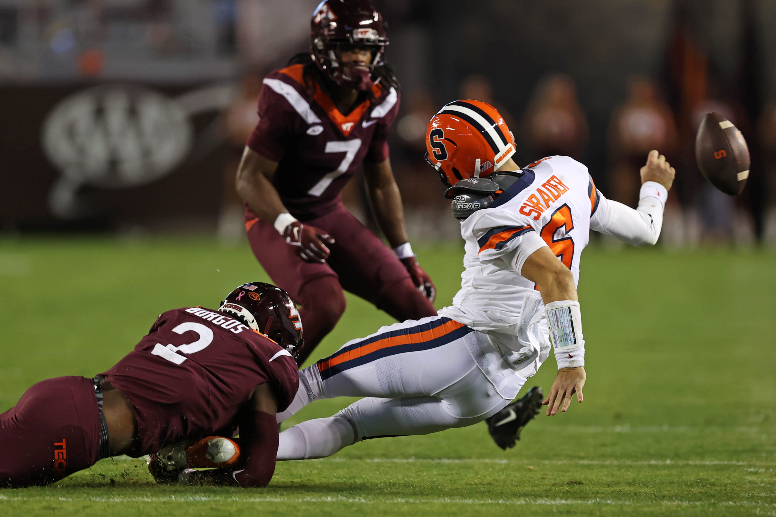 Oct 26, 2023; Blacksburg, Virginia, USA; Virginia Tech Hokies defensive lineman Keyshawn Burgos (2) forces Syracuse Orange quarterback Garrett Shrader (6) to fumble the ball out of bounds during the second quarter at Lane Stadium.