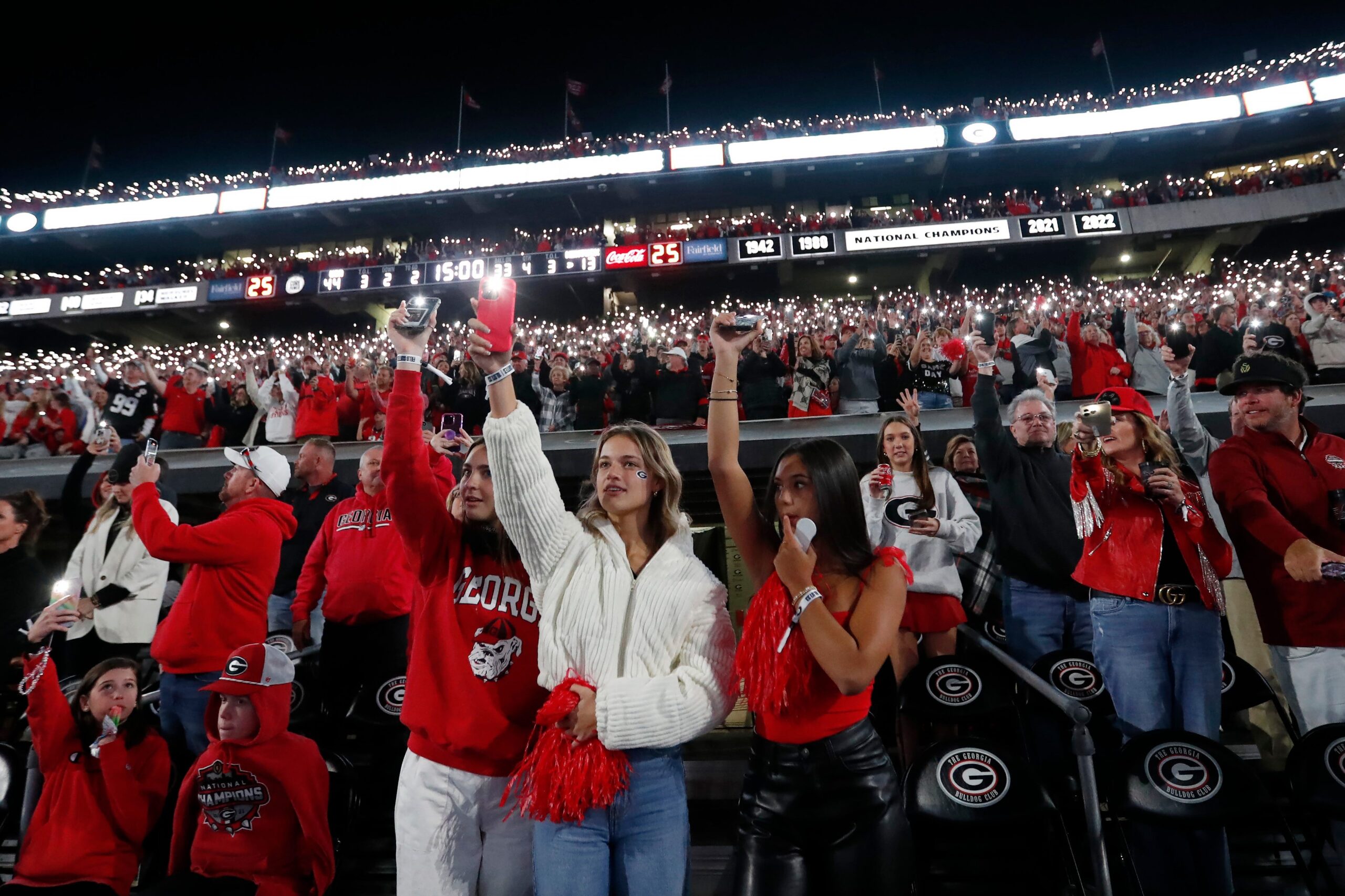 Georgia fans light up Sanford Stadium as the game goes into the fourth during the second half of a NCAA college football game against Kentucky in Athens, Ga., on Saturday, Oct. 7, 2023.