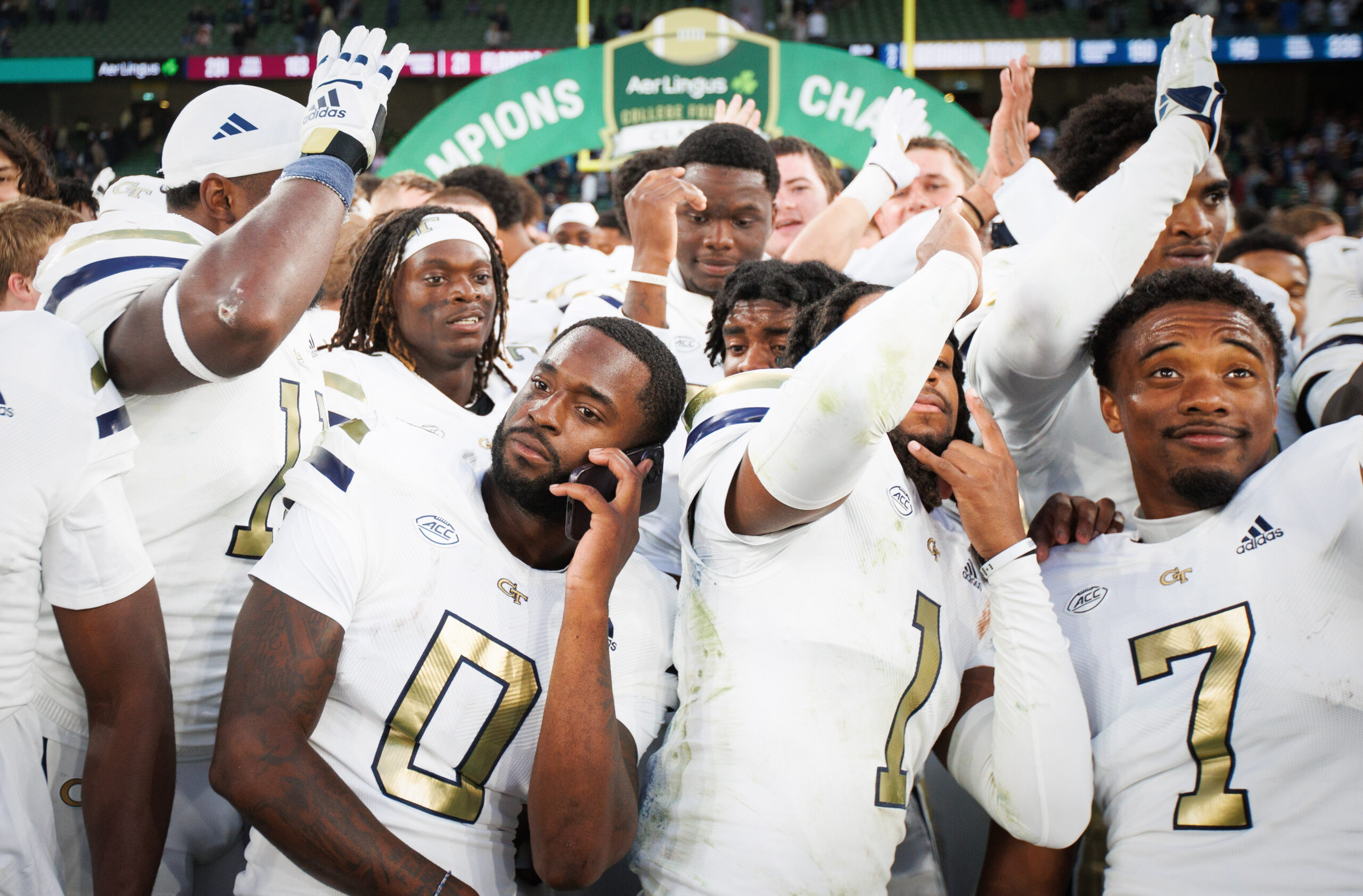 Aug 24, 2024; Dublin, IRL; Georgia Tech players Christian Leary, LaMiles Brooks and Chase Lane celebrate their win against Florida State at Aviva Stadium.