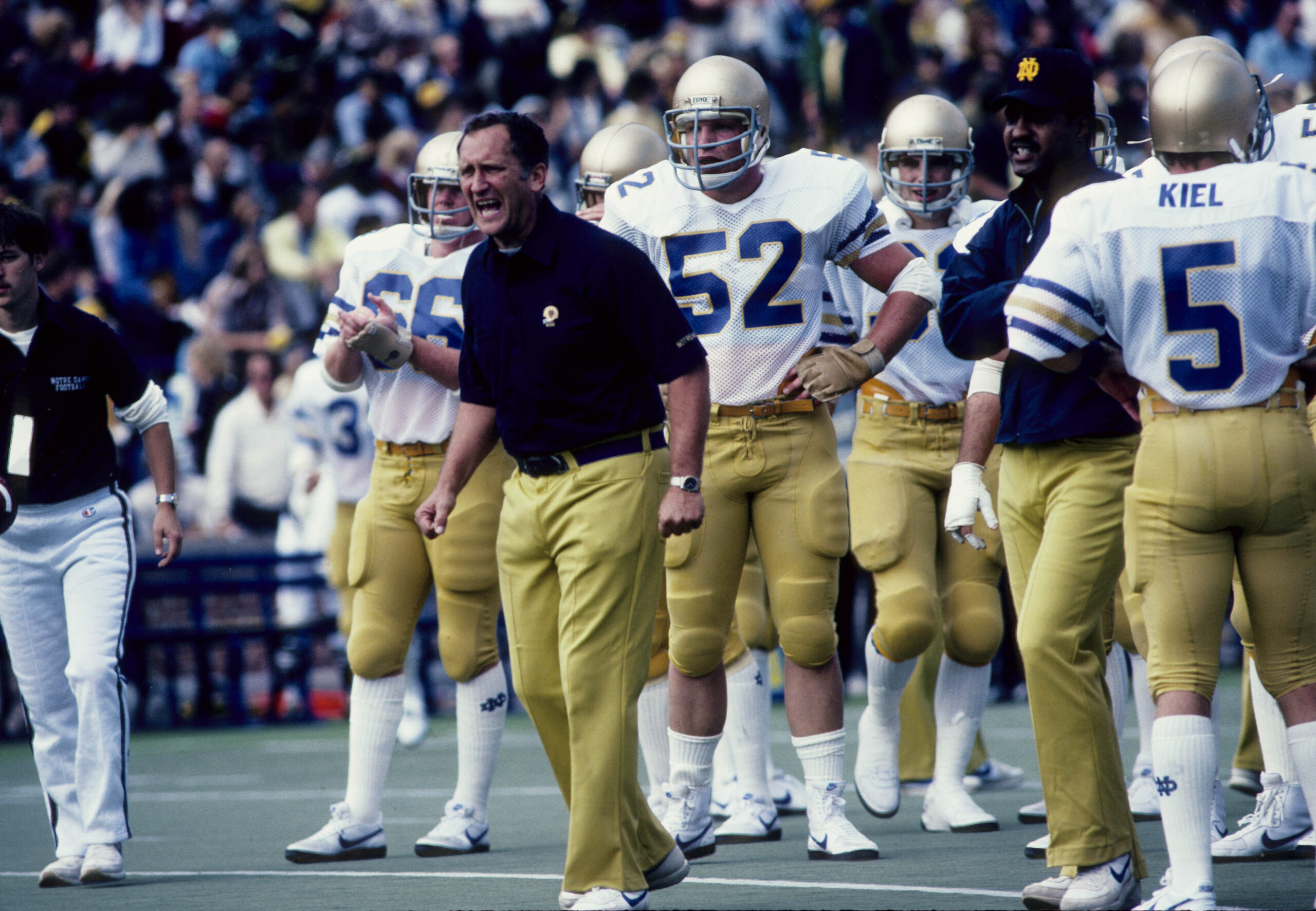 Sep 1981, unknown location, USA; FILE PHOTO; Notre Dame Fighting Irish head coach Gerry Faust (center) yells from the sidelines