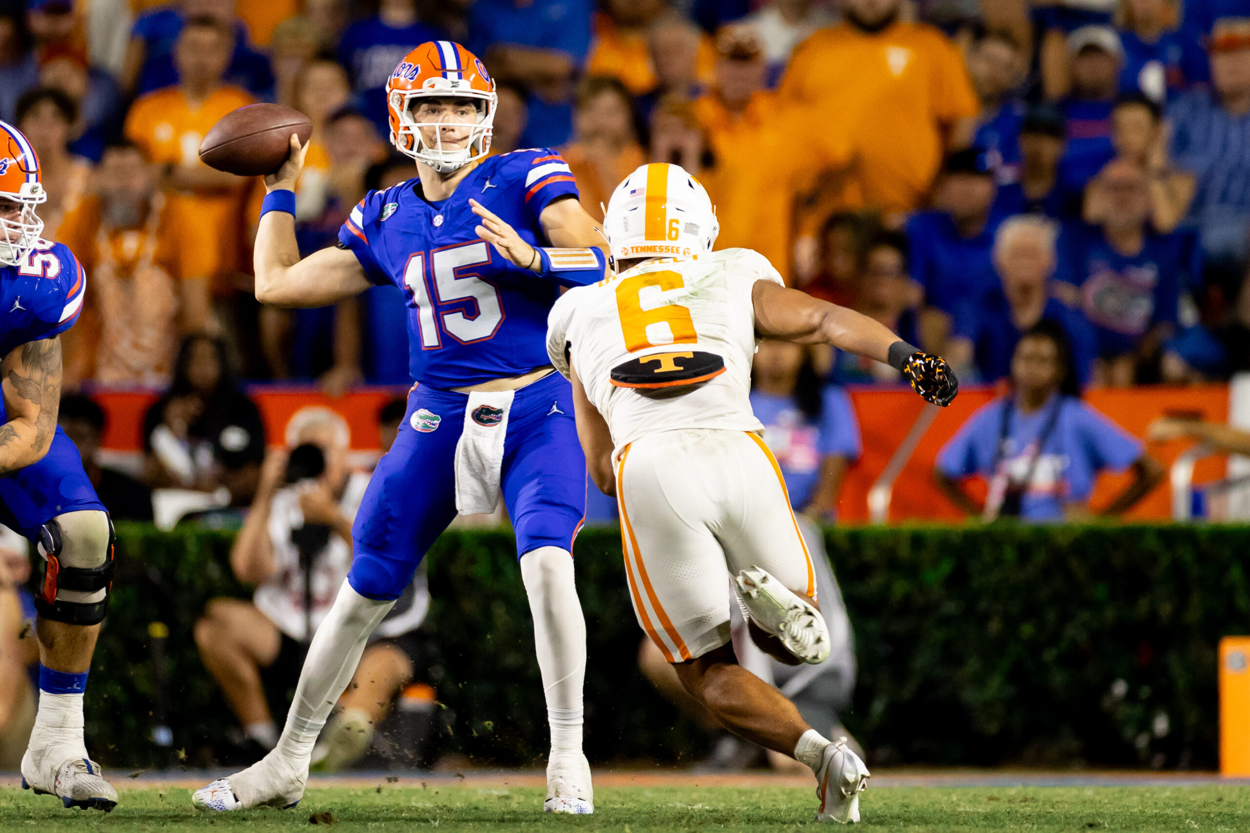 Sep 16, 2023; Gainesville, Florida, USA; Florida Gators quarterback Graham Mertz (15) throws under pressure from Tennessee Volunteers linebacker Aaron Beasley (6) during the second half at Ben Hill Griffin Stadium.
