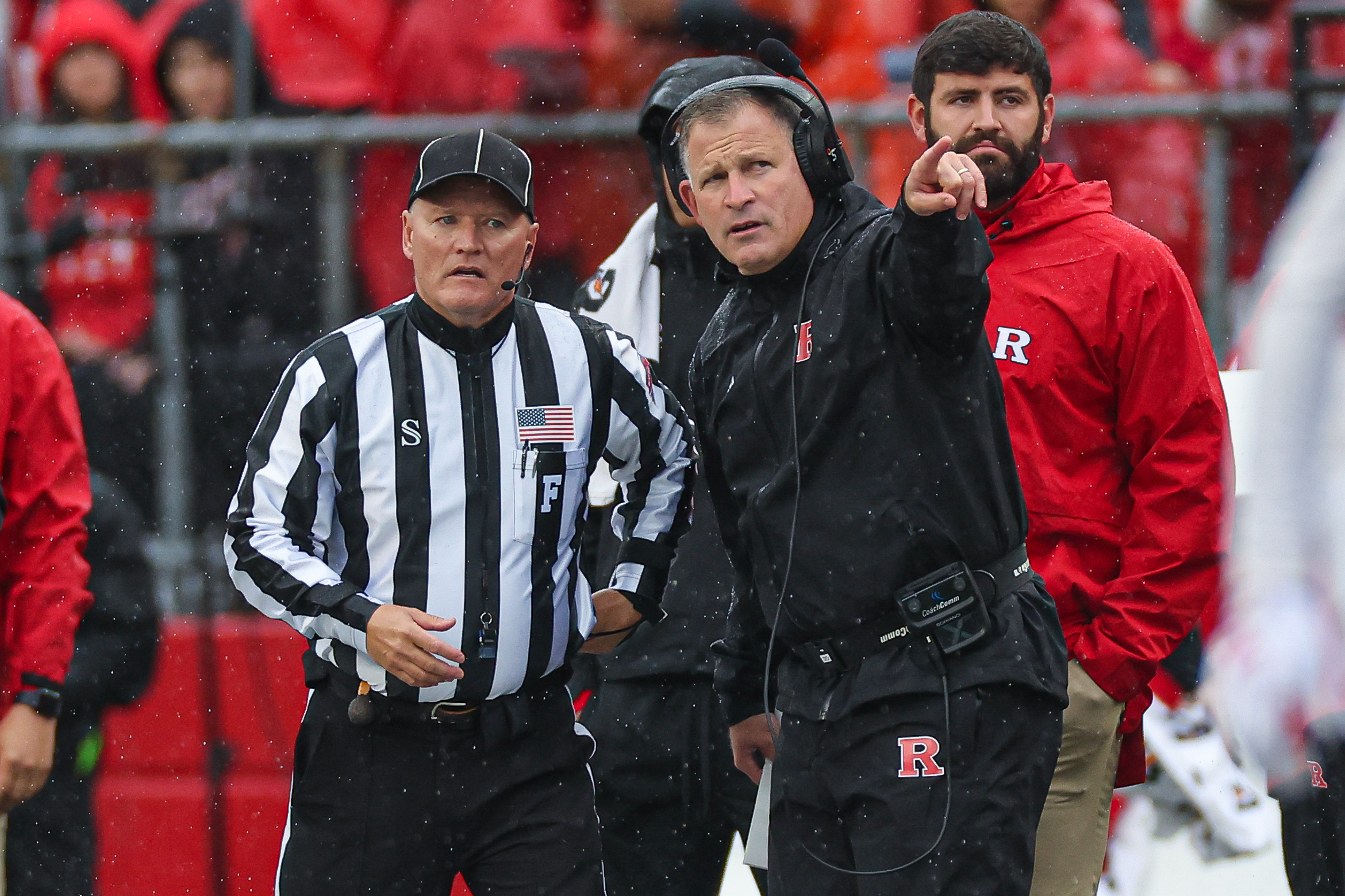 Oct 14, 2023; Piscataway, New Jersey, USA; Rutgers Scarlet Knights head coach Greg Schiano talks with an official during the first half against the Michigan State Spartans at SHI Stadium. 