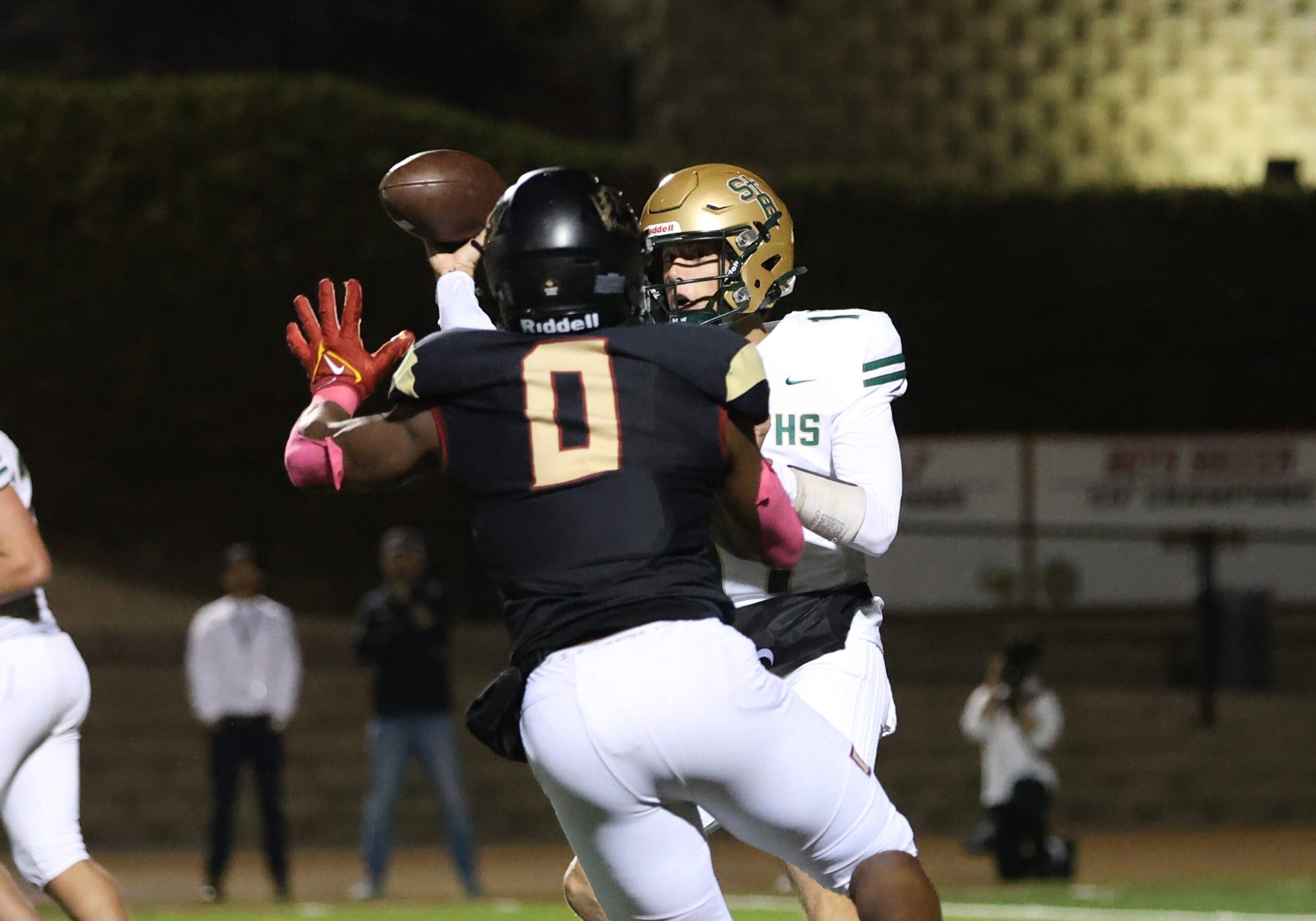 Oaks Christian's Hayden Lowe puts the pressure on St. Bonaventure's quarterback Jaxson Carper during the third quarter of tOaks Christian's 35-0 Marmonte League win over visiting St. Bonaventure Friday at Redell Field.