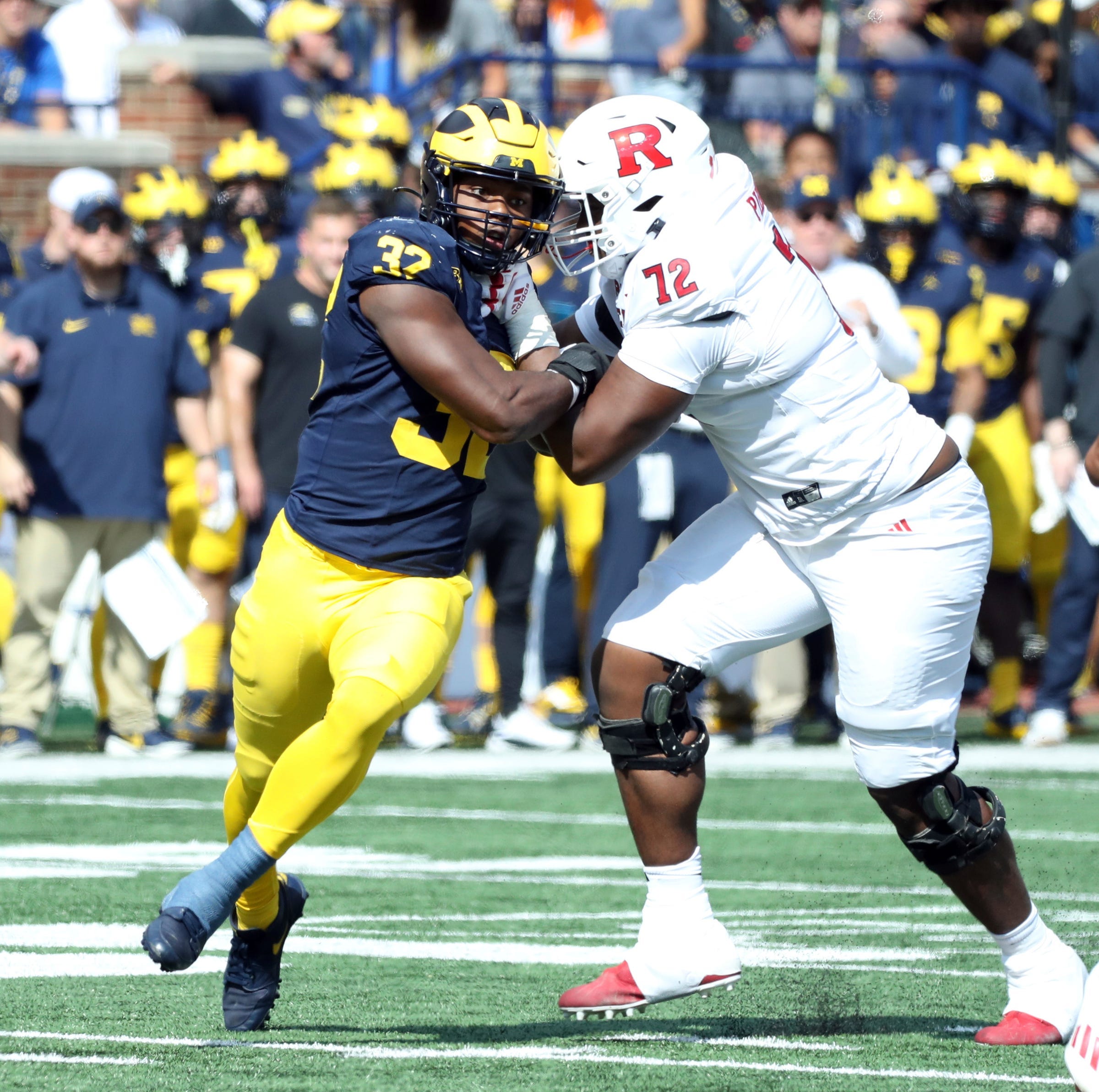 Michigan Wolverines defensive end Jaylen Harrell (32) rushes against Rutgers Scarlet Knights offensive lineman Hollin Pierce (72) during the first half at Michigan Stadium, Saturday, Sept. 23, 2023. Rutgers lost 31-7.
