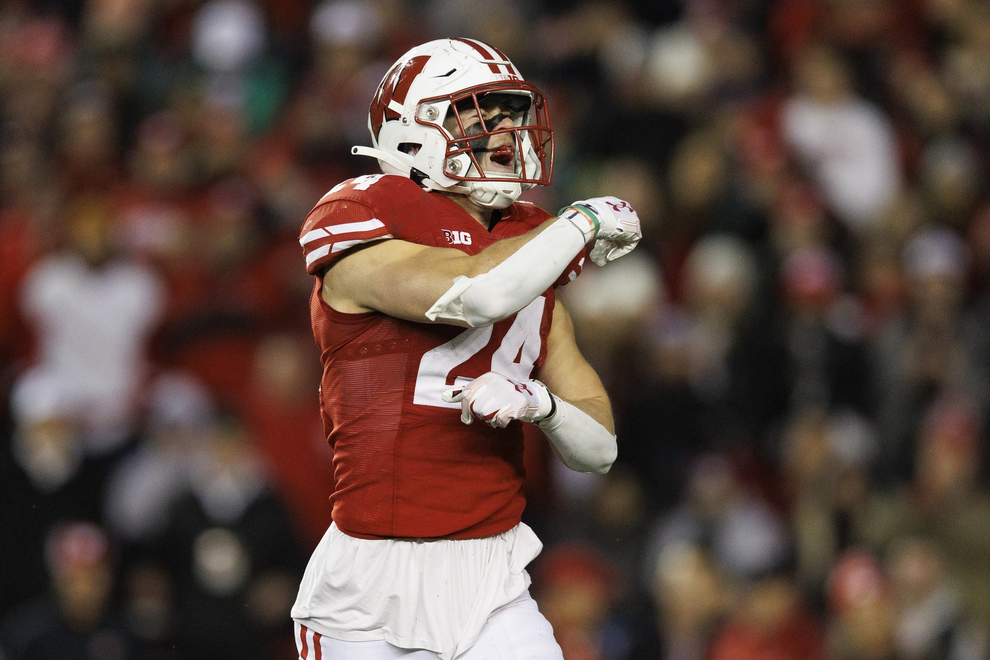 Nov 11, 2023; Madison, Wisconsin, USA; Wisconsin Badgers safety Hunter Wohler (24) celebrates following a play during the third quarter against the Northwestern Wildcats at Camp Randall Stadium.