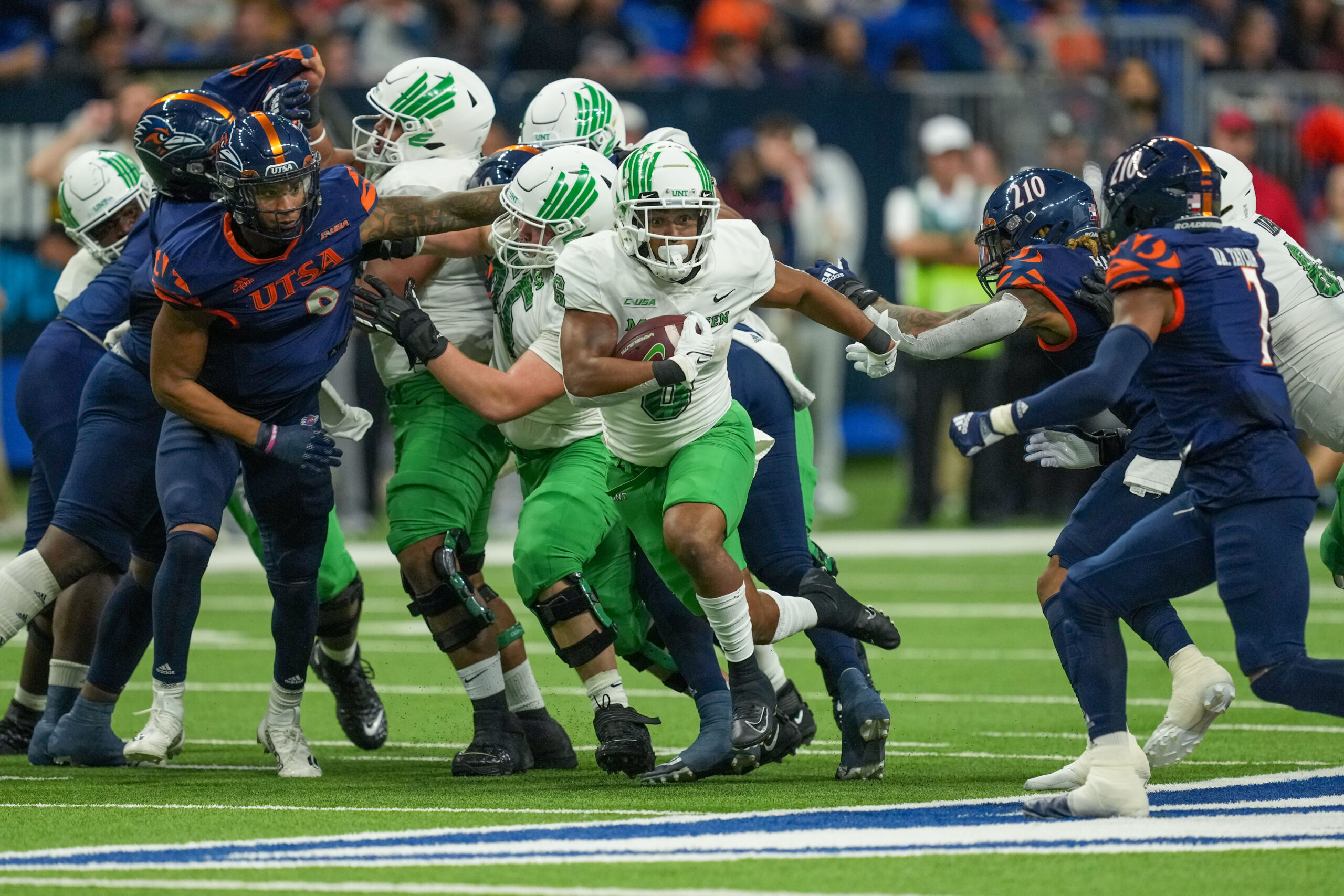 Dec 2, 2022; San Antonio, Texas, USA; North Texas Mean Green running back Ikaika Ragsdale (6) runs the ball in the first half against the UTSA Roadrunners at the Alamodome.