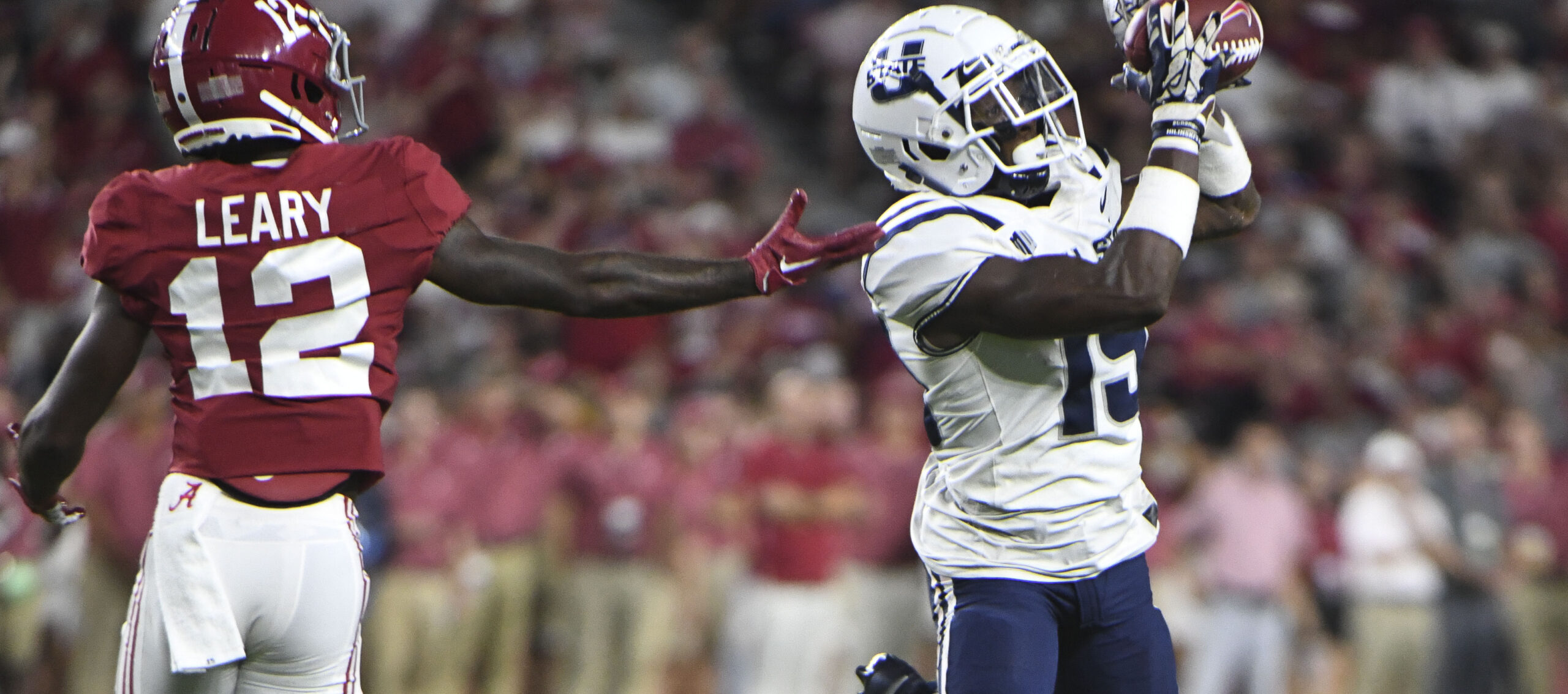 Sep 3, 2022; Tuscaloosa, Alabama, USA; Utah State Aggies defensive back Ike Larsen (19) intercepts a pass intended for Alabama Crimson Tide wide receiver Christian Leary (12) at Bryant-Denny Stadium. Alabama won 55-0.