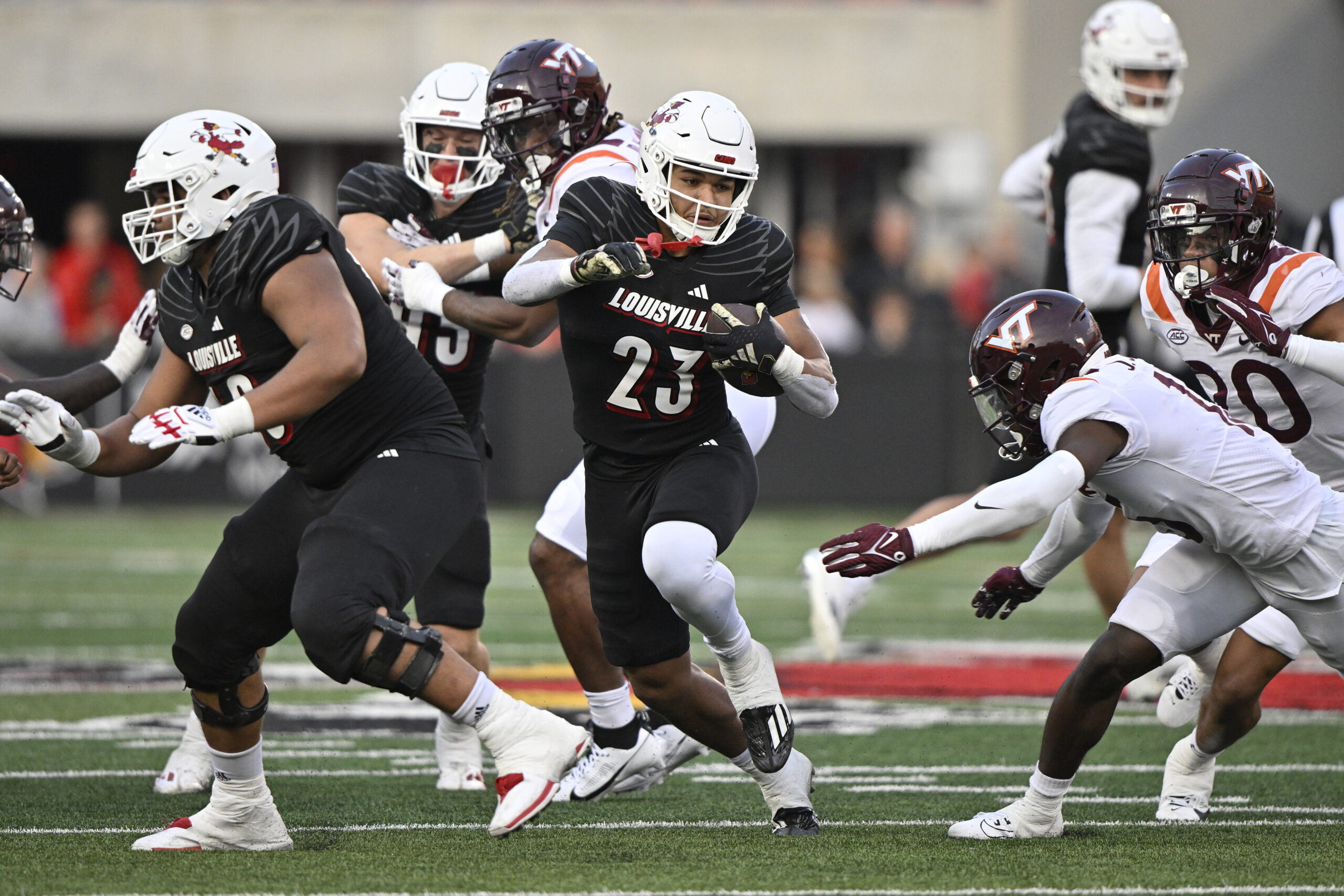 Nov 4, 2023; Louisville, Kentucky, USA; Louisville Cardinals running back Isaac Guerendo (23) runs the ball against the Virginia Tech Hokies during the second half at L&N Federal Credit Union Stadium. Louisville defeated Virginia Tech 34-3.
