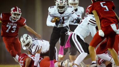 East Robertson's Isaiah Groves (11) runs the ball against Westmoreland during the first quarter at Westmoreland High School in Westmoreland