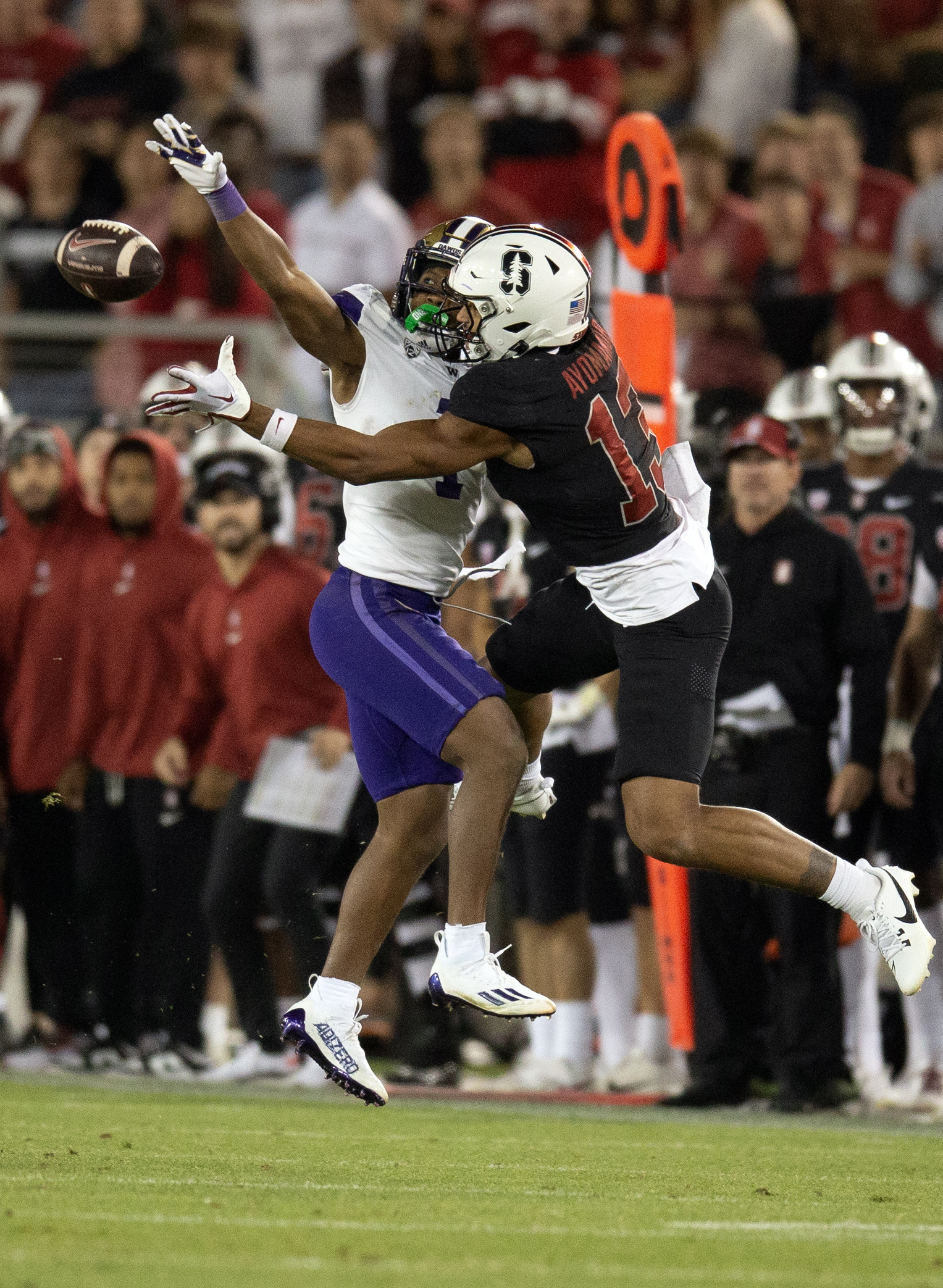 Oct 28, 2023; Stanford, California, USA; Washington Huskies cornerback Jabbar Muhammad (1) breaks up a pass intended for Stanford Cardinal wide receiver Elic Ayomanor (13) during the third quarter at Stanford Stadium. Muhammad was flagged for pass interference on the play.