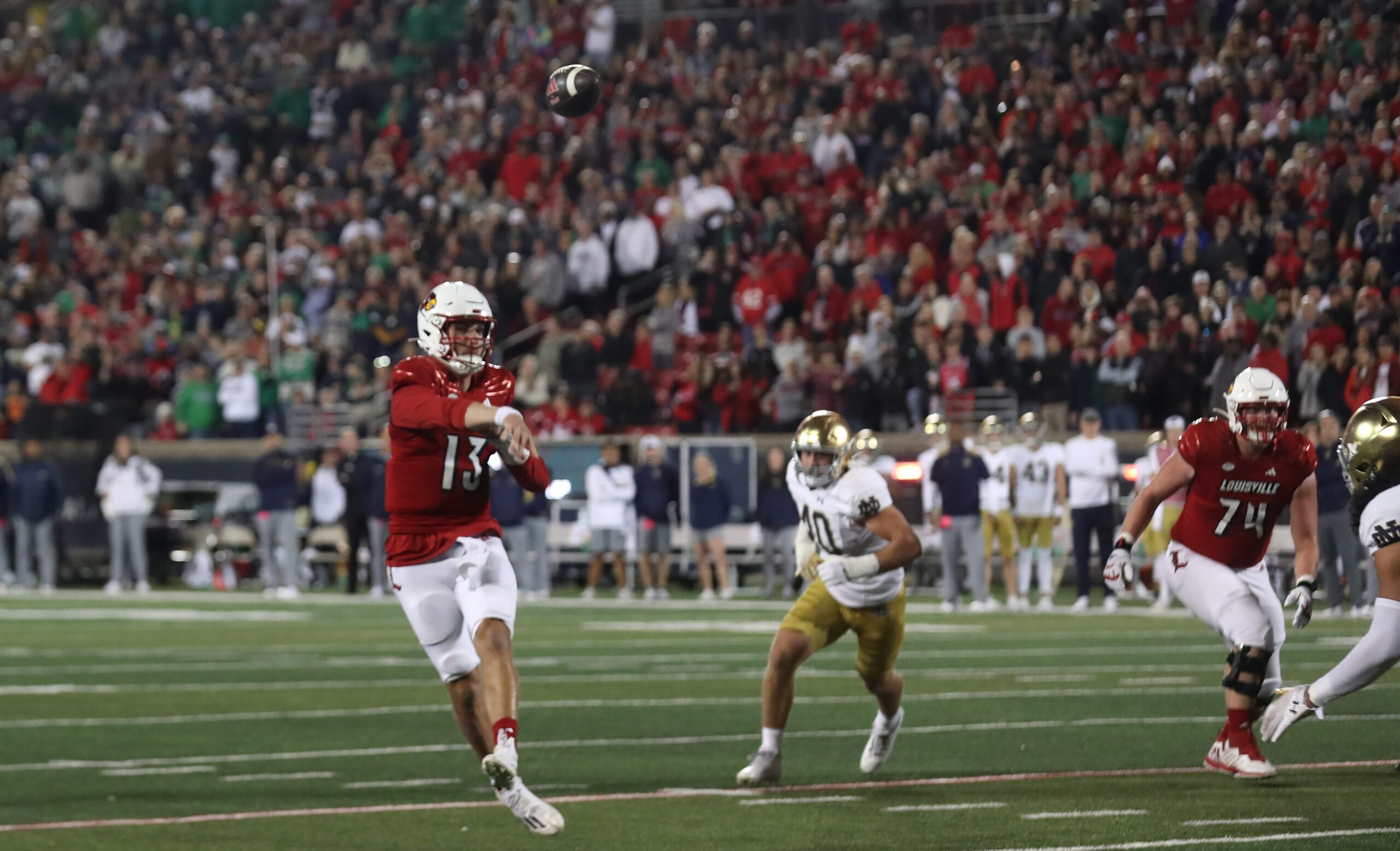 Louisville's Jack Plummer throws a touchdown to Jamari Thrash against Notre Dame at L&N Stadium. Oct. 7, 2023
