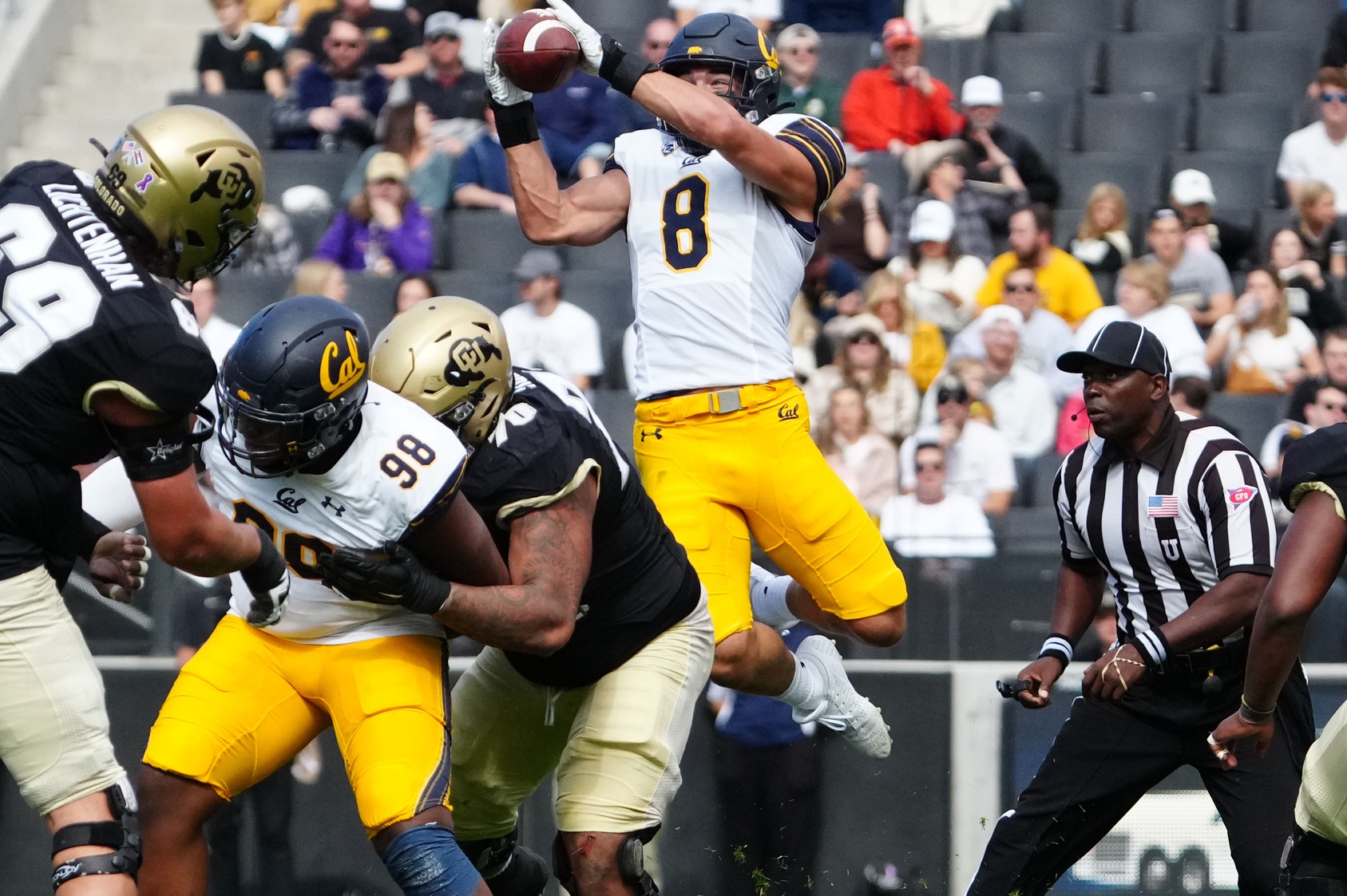 Oct 15, 2022; Boulder, Colorado, USA; California Golden Bears linebacker Jackson Sirmon (8) pulls in an interception in the first quarter against the Colorado Buffaloes at Folsom Field.
