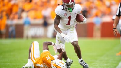 Alabama running back Jahmyr Gibbs (1) runs past Tennessee defensive back Christian Charles (14) during Tennessee's game against Alabama in Neyland Stadium in Knoxville
