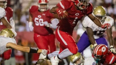 Germantown's Jamarion Morrow (1) runs the ball into the end zone