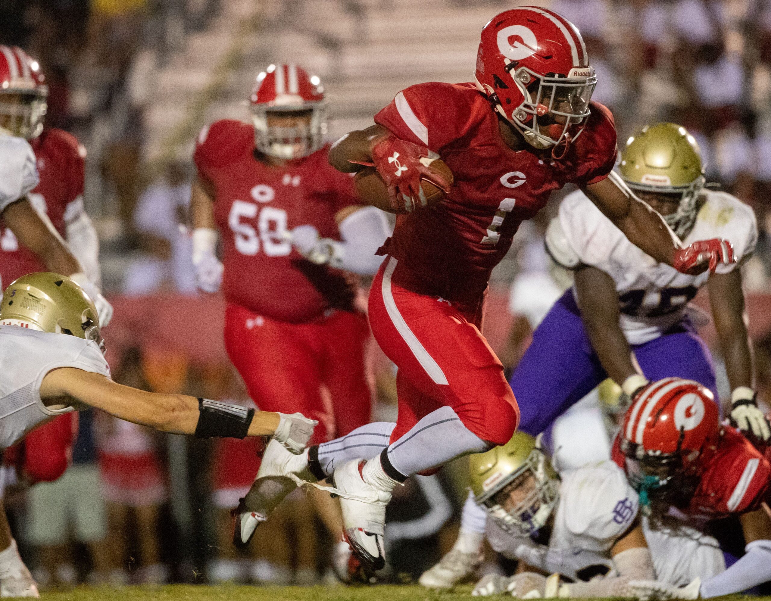 Germantown's Jamarion Morrow (1) runs the ball into the end zone, scoring the winning touchdown, during a game Saturday, Aug. 20, 2022, at Germantown High School. Germantown defeated Christian Brothers 26-20.