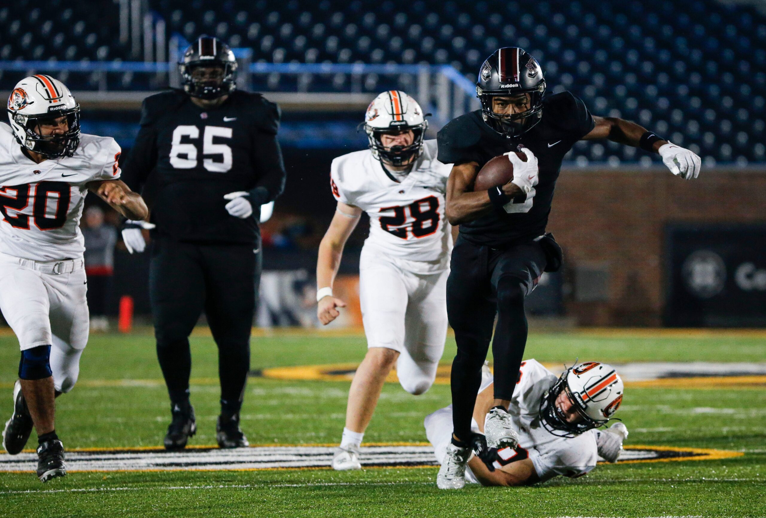 Cardinal Ritter's Jamarion Parker (3) carries the ball for a touchdown on the Republic Tigers during the Class 5 State Championship football game at Faurot Field in Columbia, Mo. on Friday, Dec. 1, 2023.