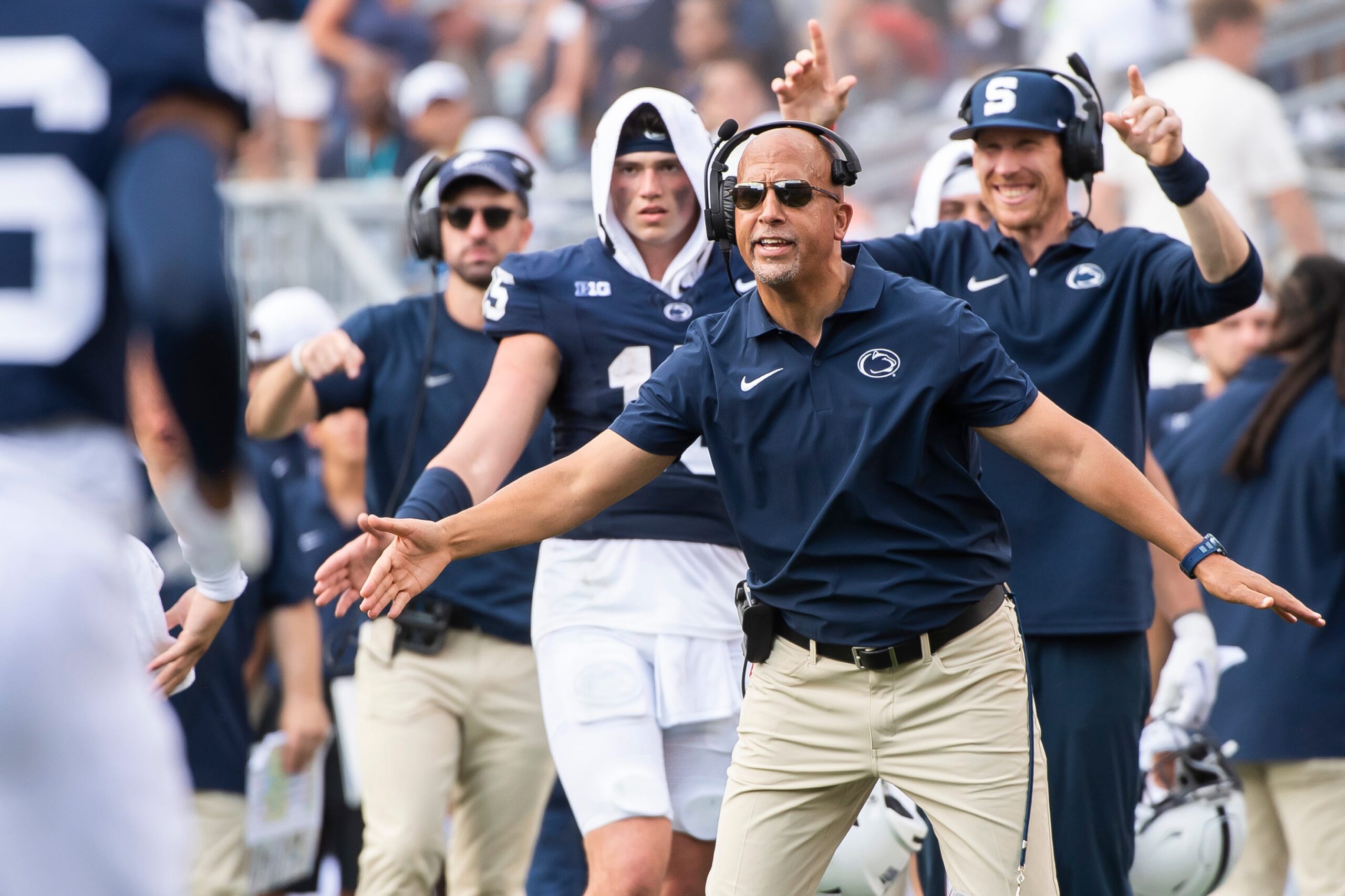 Penn State head football coach James Franklin holds out his hands to greet the offensive back to the sideline after a 4-yard touchdown pass from Beau Pribula to Omari Evans against Delaware Saturday, Sept. 9, 2023, in State College, Pa.