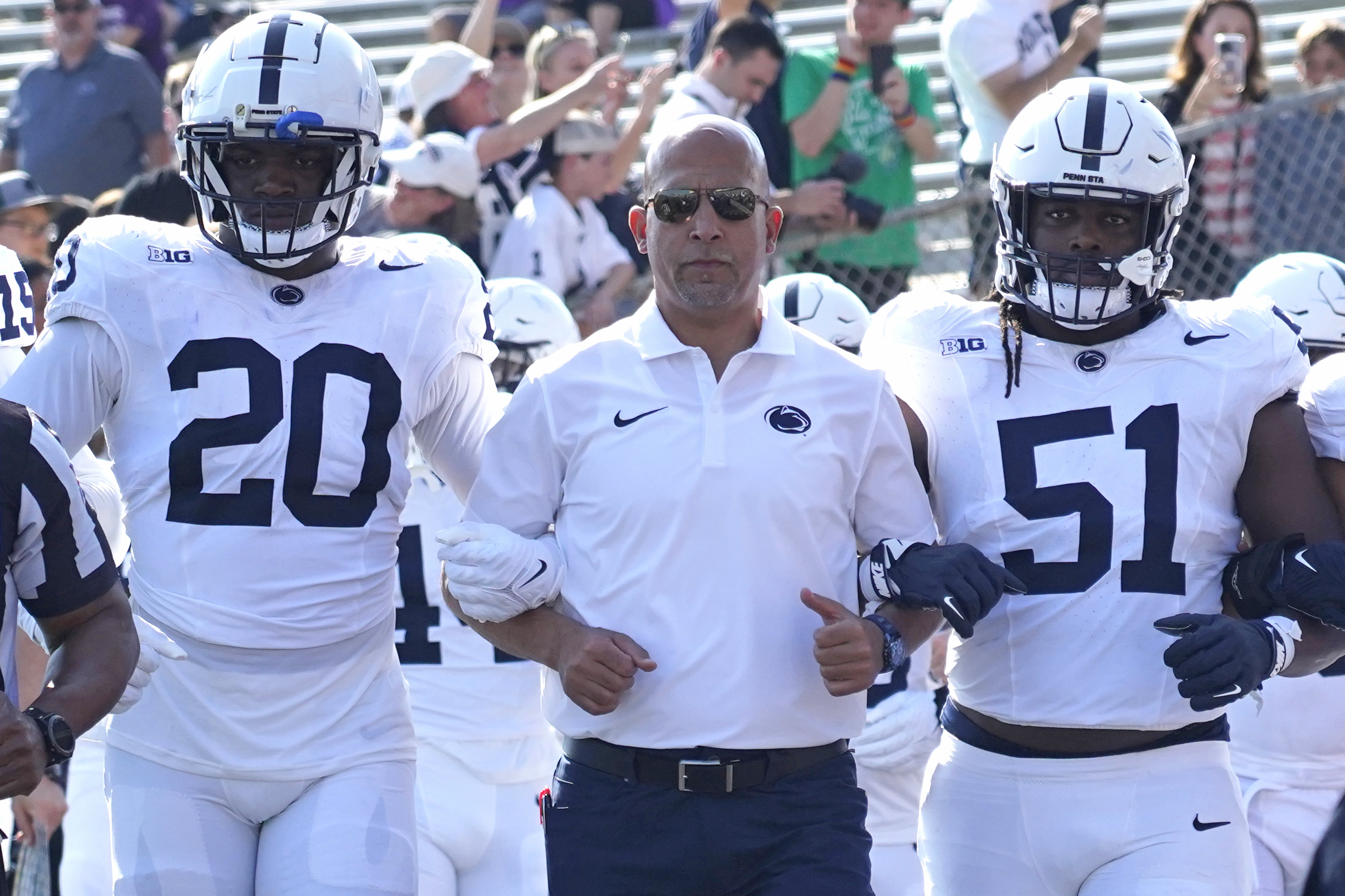 Sep 30, 2023; Evanston, Illinois, USA; Penn State Nittany Lions head coach James Franklin leads his team on the field against the Northwestern Wildcats at Ryan Field.