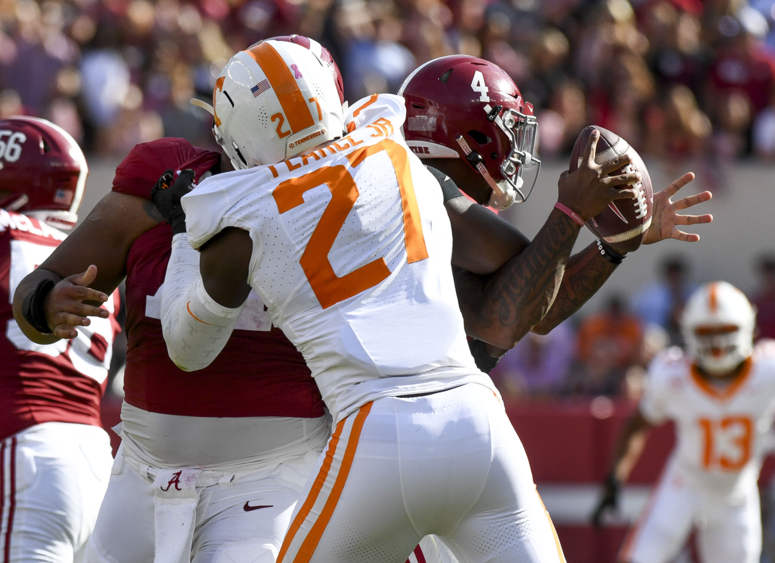 Oct 21, 2023; Tuscaloosa, Alabama, USA; Tennessee Volunteers defensive lineman James Pearce Jr. (27) causes a fumble by Alabama Crimson Tide quarterback Jalen Milroe (4) which Tennessee recovered at Bryant-Denny Stadium. Mandatory Credit: Gary Cosby Jr.-USA TODAY Sports