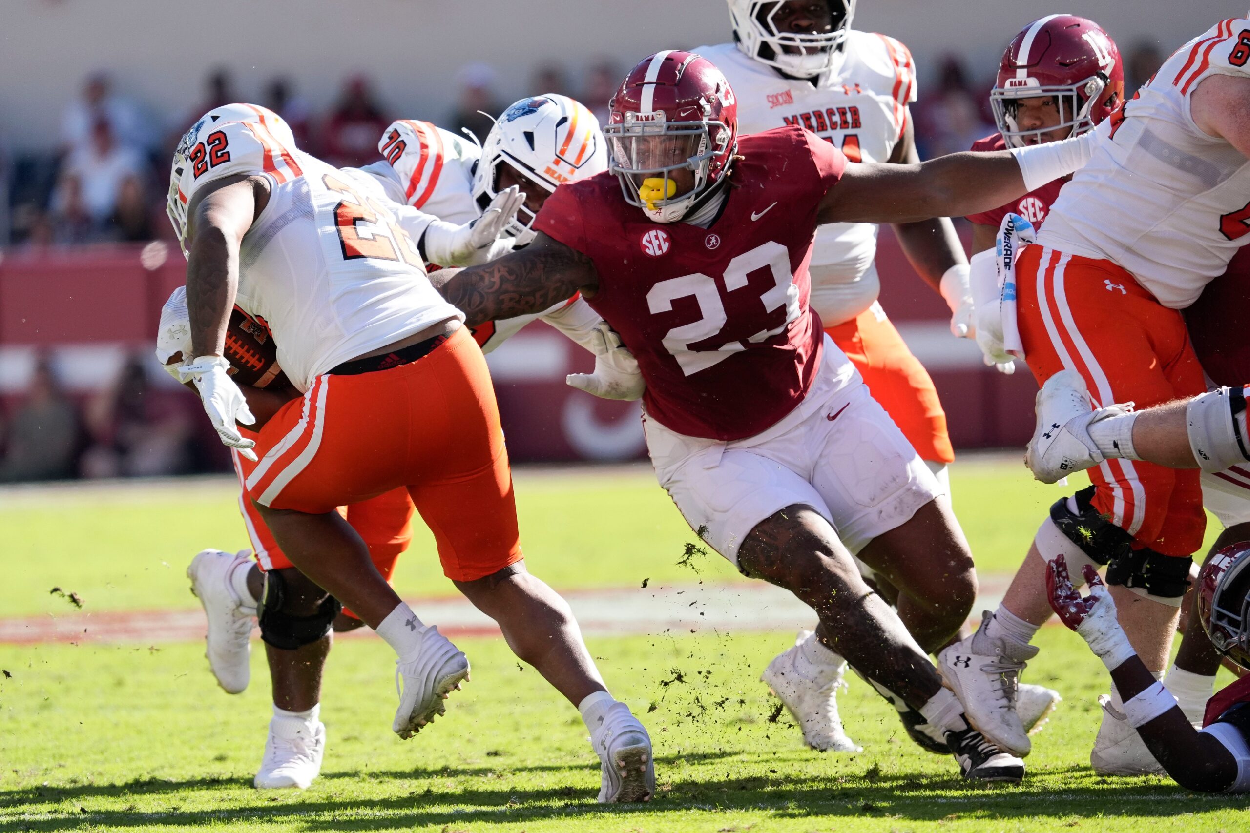 Nov 16, 2024; Tuscaloosa, AL, USA; Mercer running back CJ Miller (22) cuts back against Alabama Crimson Tide defensive lineman James Smith (23) at Bryant-Denny Stadium.