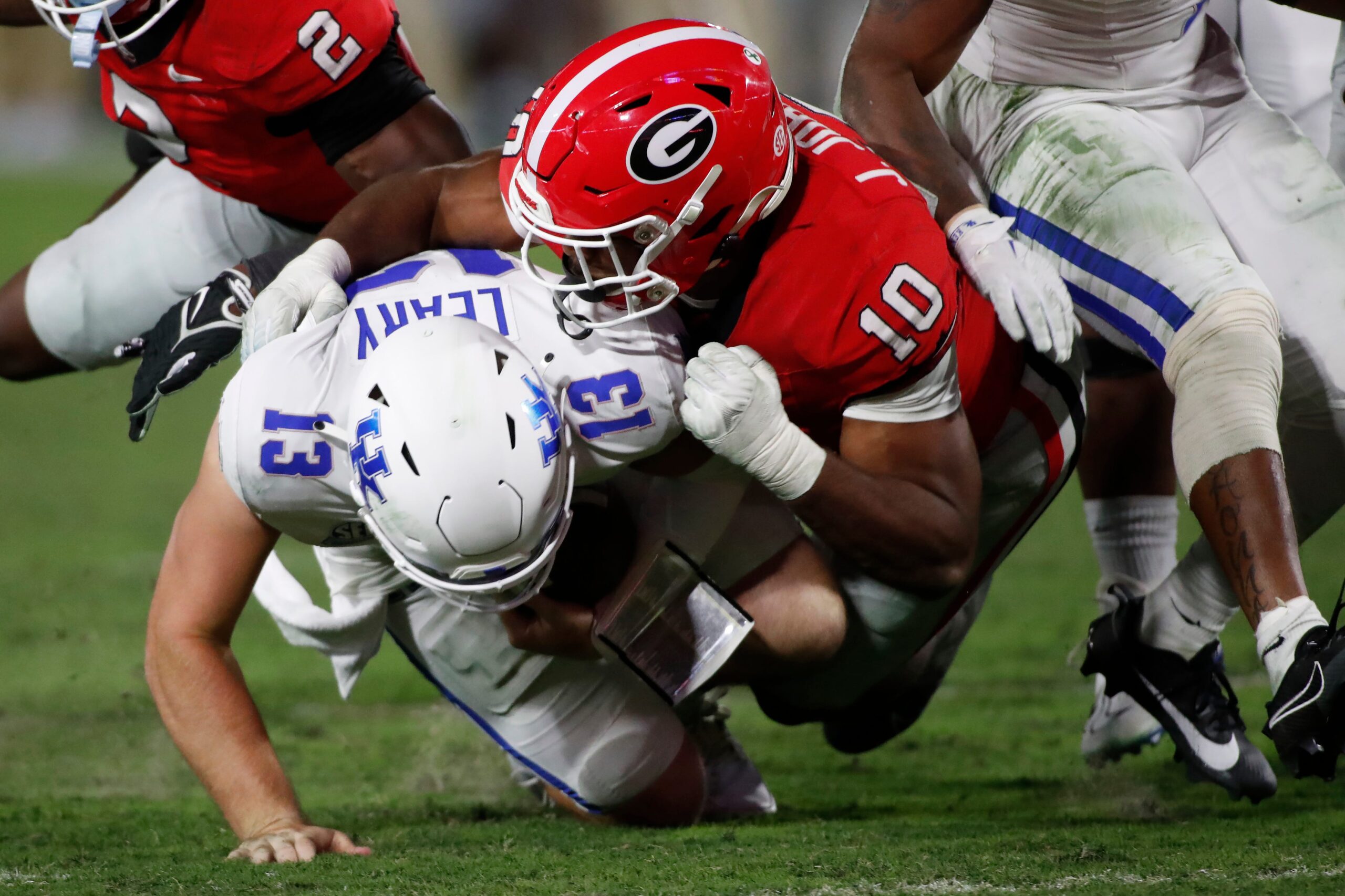 Georgia linebacker Jamon Dumas-Johnson (10) sacks Kentucky quarterback Devin Leary (13) during the second half of a NCAA college football game in Athens, Ga., on Saturday, Oct. 7, 2023.