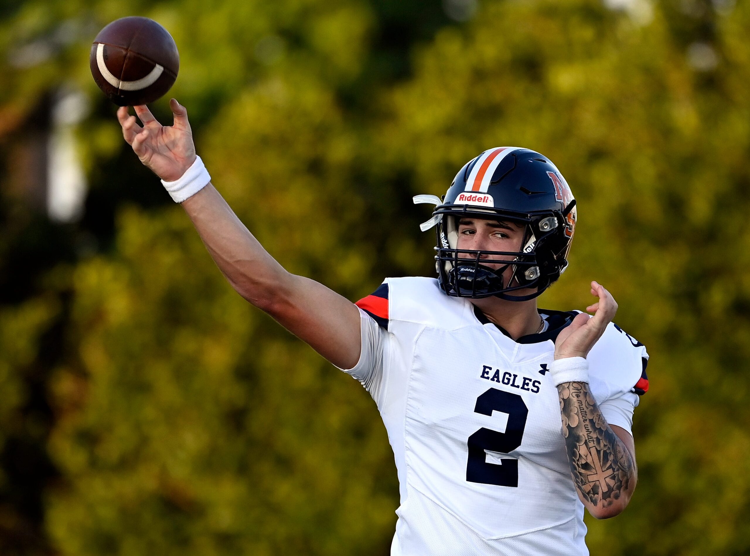 Nashville Christian quarterback Jared Curtis (2) passes as he warms up before an high school football scrimmage against Franklin Road Academy Friday, Aug. 16, 2024, in Nashville, Tenn.