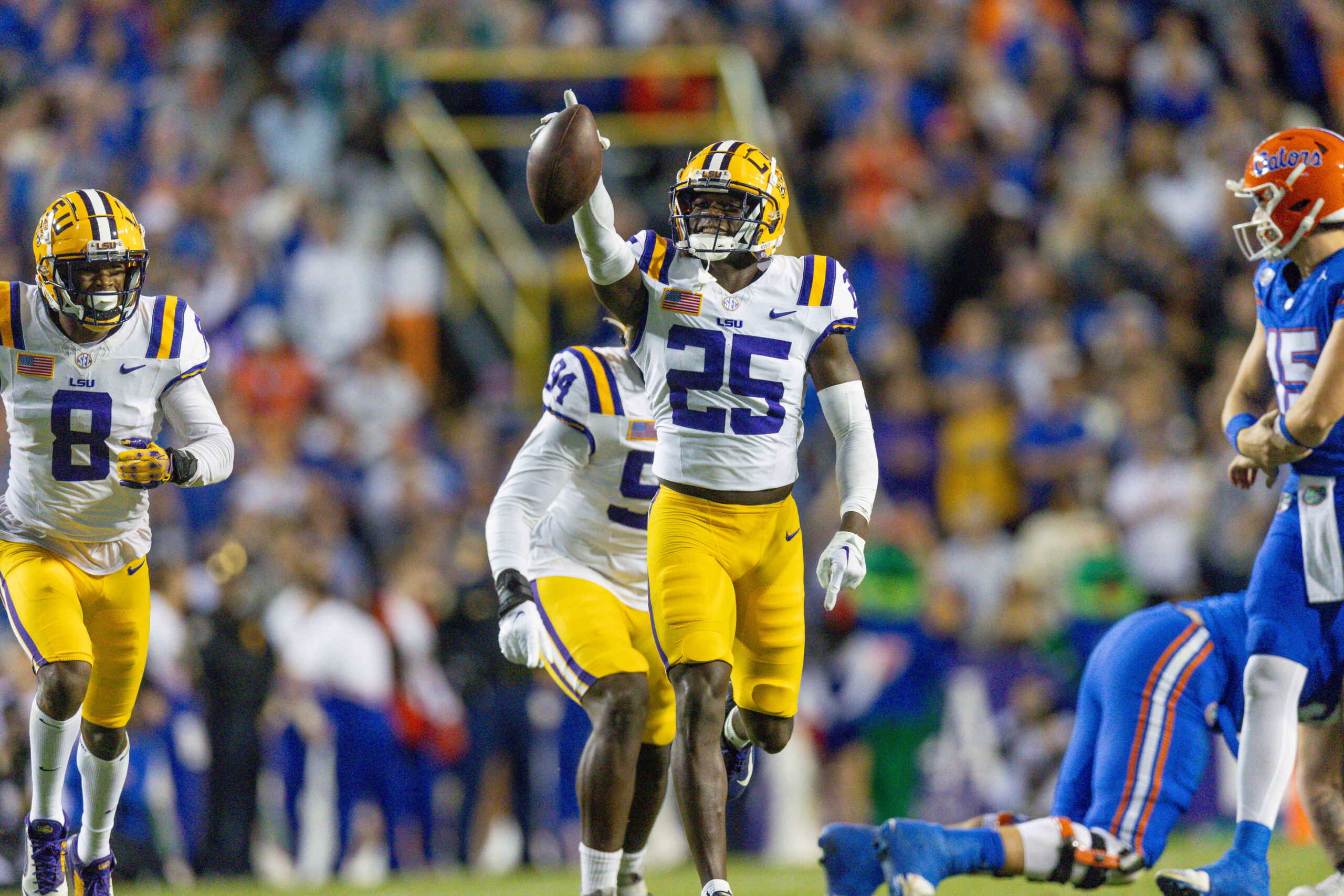 Nov 11, 2023; Baton Rouge, Louisiana, USA; LSU Tigers safety Javien Toviano (25) recovers a fumble against the Florida Gators during the first half at Tiger Stadium.