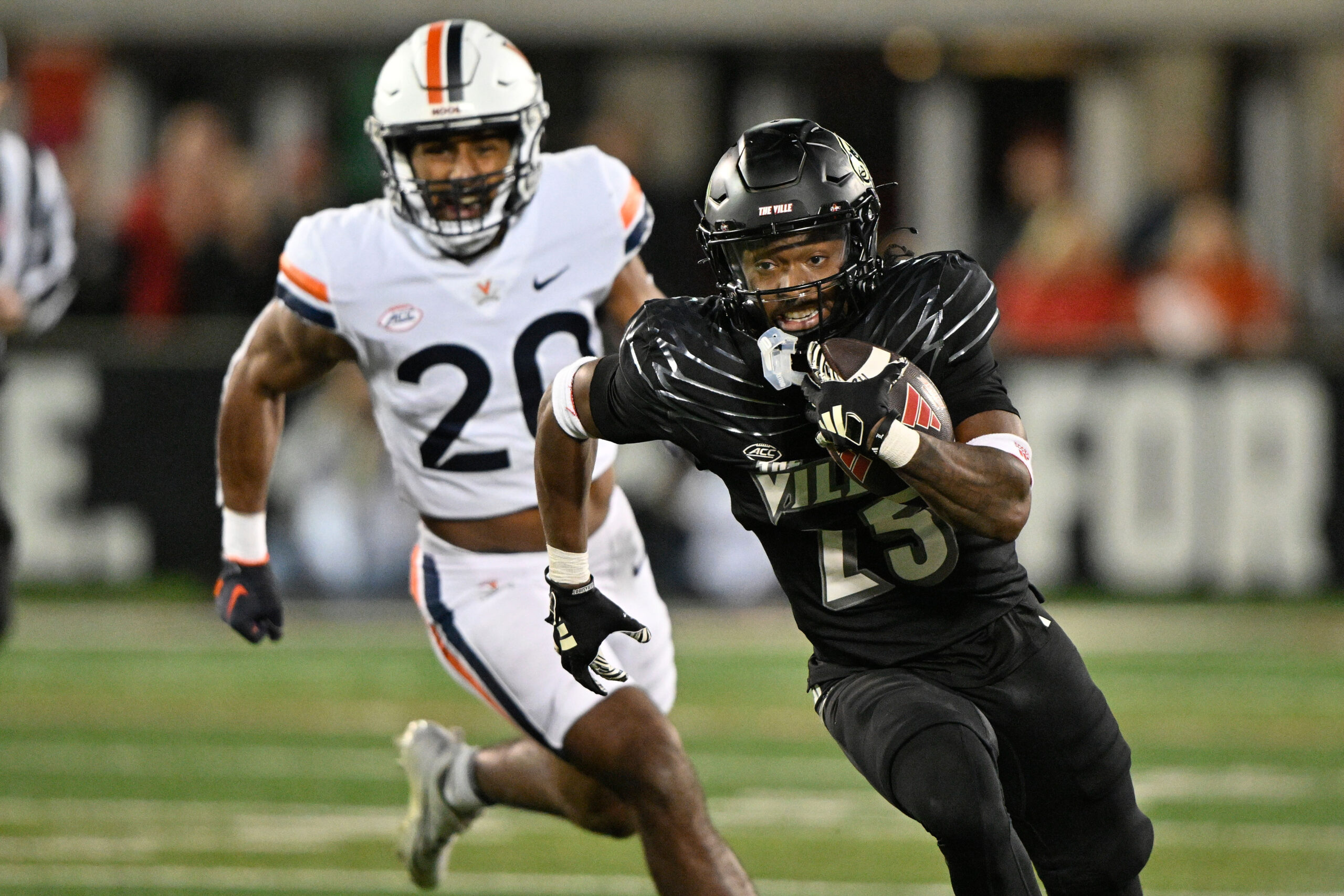 Nov 9, 2023; Louisville, Kentucky, USA; Louisville Cardinals running back Jawhar Jordan (25) runs the ball against the Virginia Cavaliers during the first quarter at L&N Federal Credit Union Stadium. Louisville defeated Virginia 31-24.