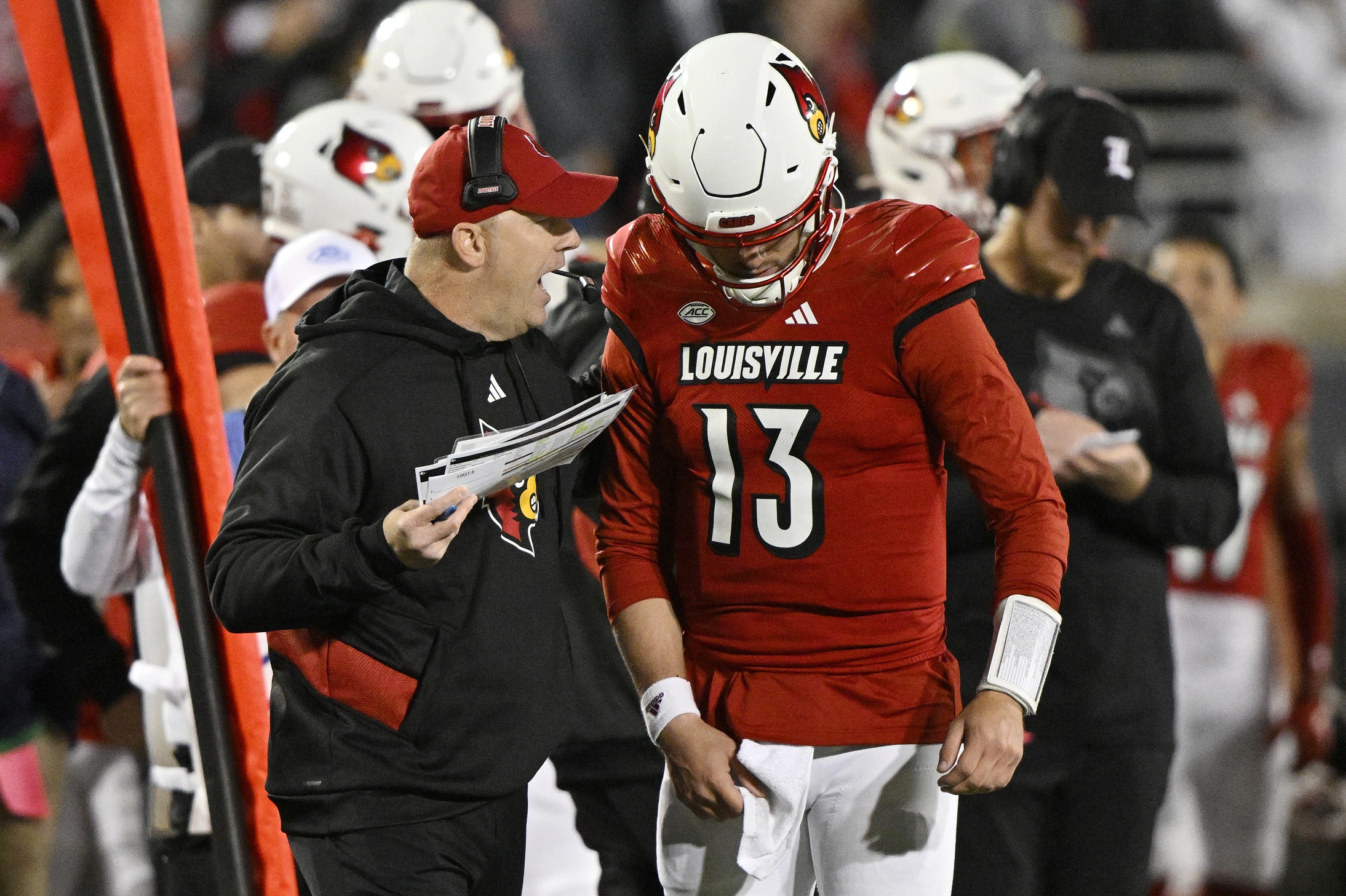 Oct 7, 2023; Louisville, Kentucky, USA; Louisville Cardinals head coach Jeff Brohm gives instruction to quarterback Jack Plummer (13) during the second half against the Notre Dame Fighting Irishat L&N Federal Credit Union Stadium. Louisville defeated Notre Dame 33-20.