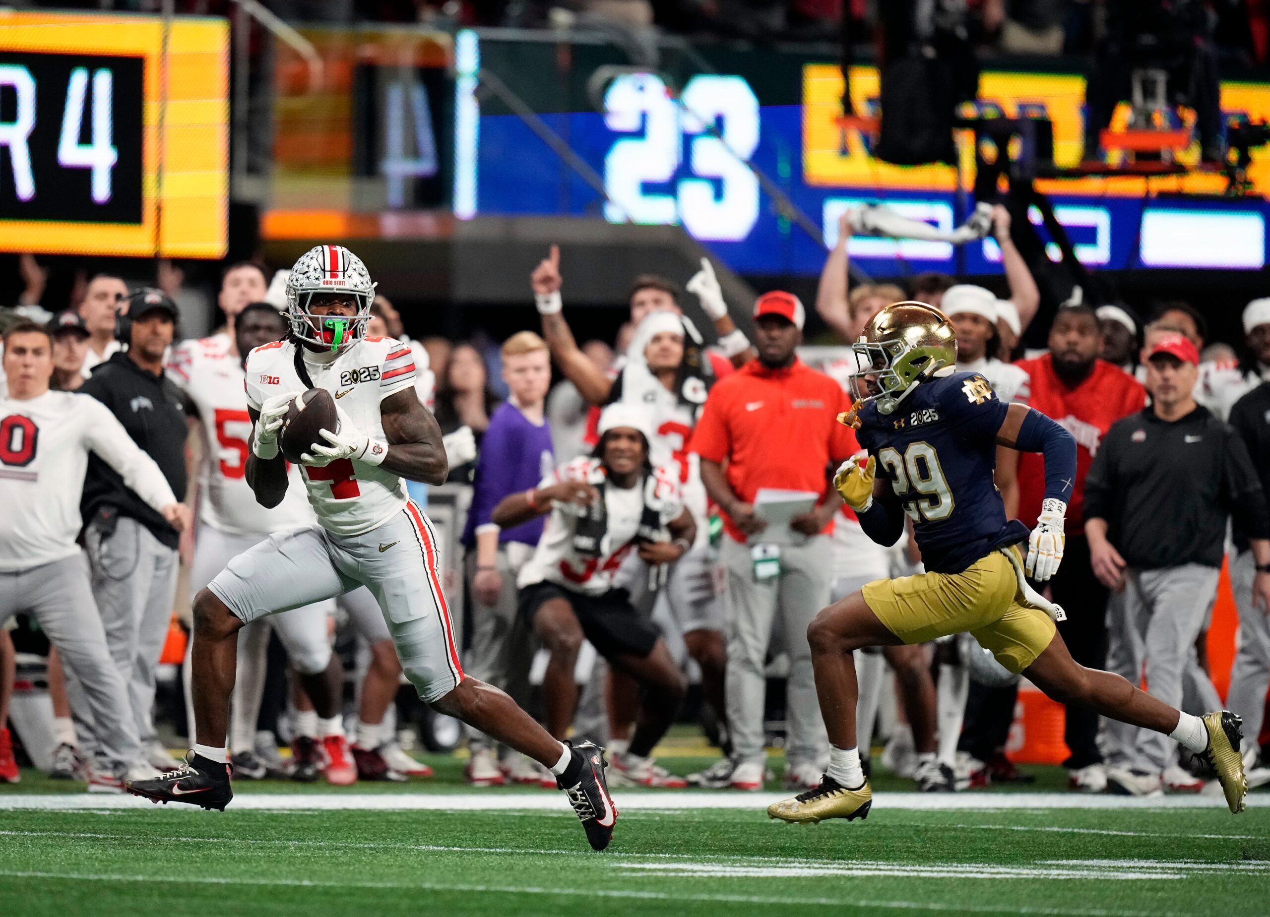 Michigan State's Ed Woods, left, tackles Ohio State's Jeremiah Smith during the first quarter on Saturday, Sept. 28, 2024, at Spartan Stadium in East Lansing.
