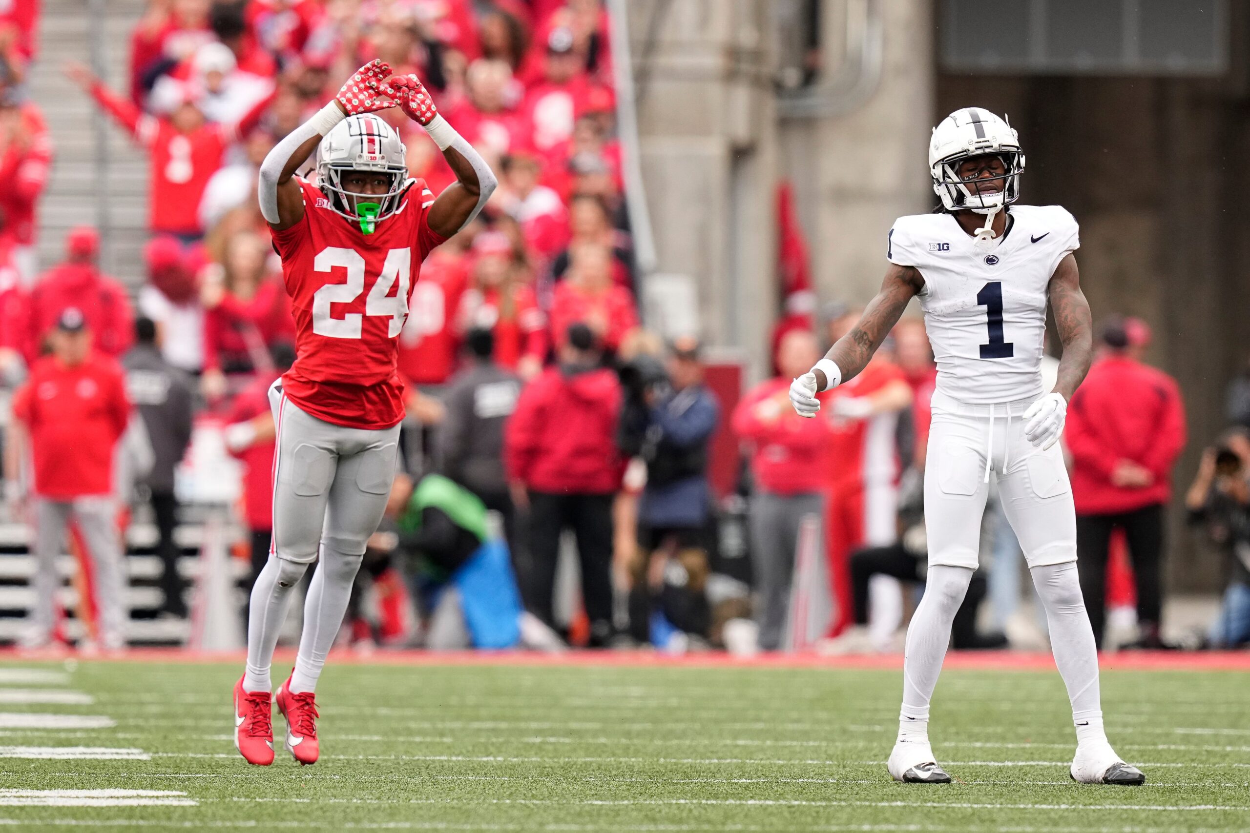 Oct 21, 2023; Columbus, Ohio, USA; Ohio State Buckeyes cornerback Jermaine Mathews Jr. (24) celebrates a pass break up on a ball intended for Penn State Nittany Lions wide receiver KeAndre Lambert-Smith (1) during the second half of the NCAA football game at Ohio Stadium. Ohio State won 20-12.